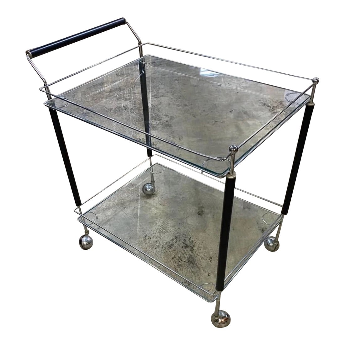 Mid 20th Century Modern Chrome and Glass Two-Level Bar Cart on Wheels: Elevate your entertaining game with this Retro Midcentury Modern Chrome and Glass Two-Level Bar Cart. Featuring sleek chrome framing and clear glass shelves, this versatile cart offers both style and
