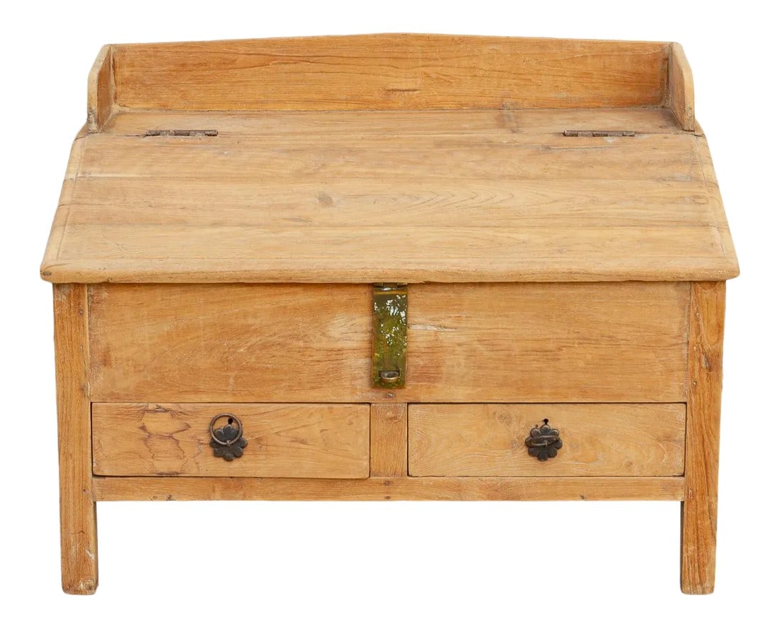 19th Century British Colonial Teak Low Desk: Charming antique floor desk from India. This 19th century low writing table has been traditionally used for centuries across India by merchants or shop-keepers. It is made from teak wood and features