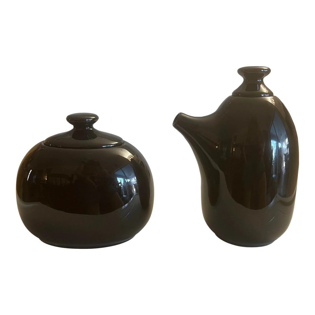 2000"šÃ„Ã´s Lindt-Stymeist Creamer & Sugar Set- a Pair: 20th Century Glossy Black ceramic lidded sugar and creamer set by Lindt-Stymeist Discontinued. Creamer with lid is 6" tall x 3" x4" Sugar with lid measures 5"tall x 3" x 3.5" Condition: Alterations: O