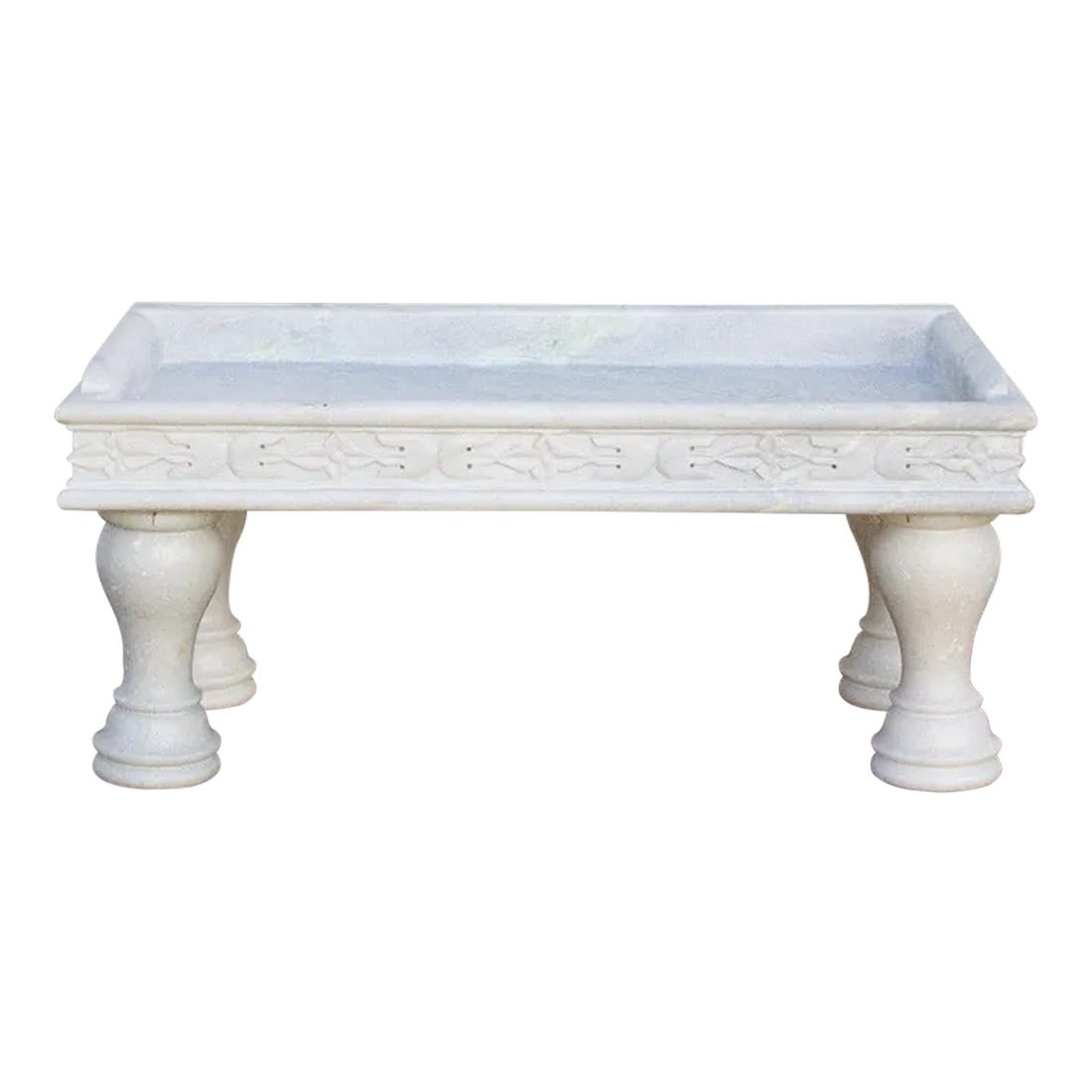Floral Handcarved Marble Trough Coffee Table: Originally found in Northwest India, this elegant trough design has been recreated into a charming coffee table. This exceptional handcarved coffee table is made from a thick shaped slab as the top st