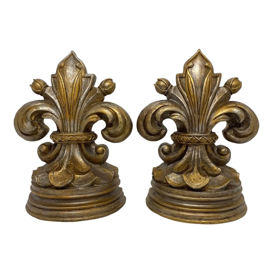 Late 20th Century Fleur De Lis Bookends With Antique Gold Finish - a Pair: Handsome Pair of Fleur De Lis Bookends With Antique Gold Finish. These bookends are made of a heavy resin. The Bookends are in excellent condition with no major imperfections. One Bookend has a very m