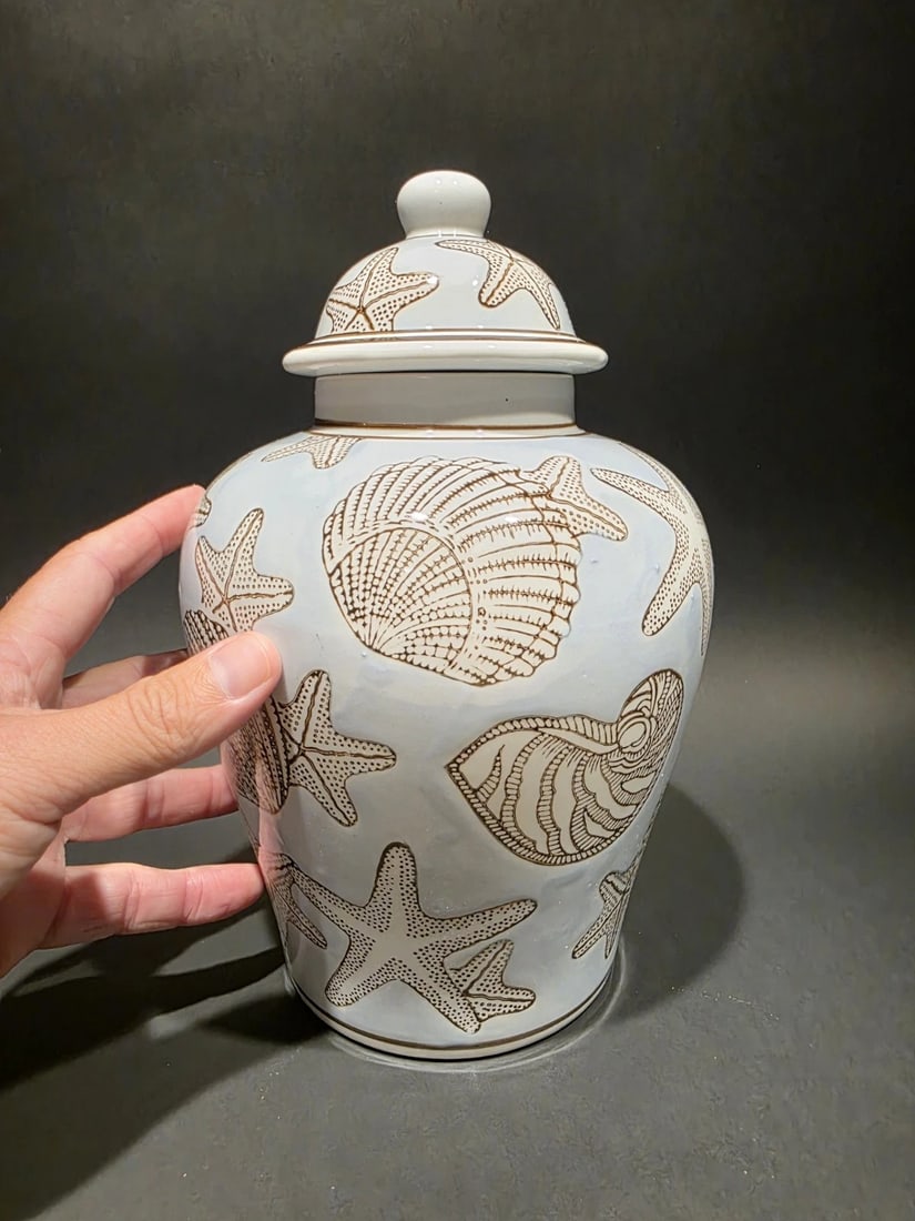 10" Sea Blue Ceramic Coastal Seashell Jar: Title: 10" Sea Blue Ceramic Coastal Seashell Jar Description: 10" Tall Coastal Seashell Ceramic Ginger Jar – Sea Blue with Gold Accents Inspired by mid-century and Chinoiserie revival design, th