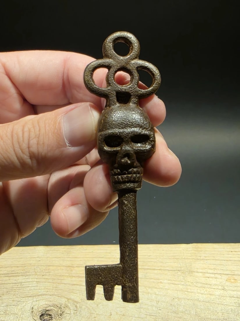 3 1/2" Iron Skeleton Key: Title: 3 1/2" Iron Skeleton Key Description: 3 1/2 " Antique-Style Cast Iron Skull Key – Vintage Gothic Reproduction This aged cast iron key features a bold skull motif, echoing the curiosity an