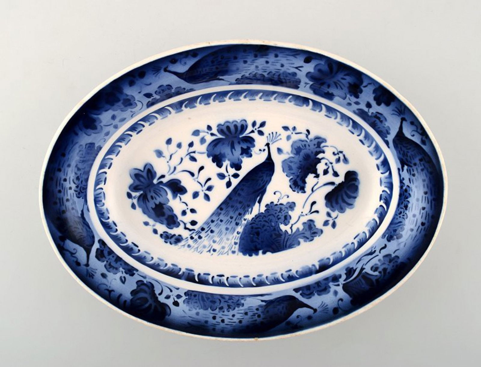 Peacock from Copenhagen's faience factory / Aluminia. Large bowl in faience.: Title: Peacock from Copenhagen's faience factory / Aluminia. Large bowl in faience. Description: Peacock from Copenhagen's faience factory / Aluminia. Large bowl in faience. We have many pieces on sto