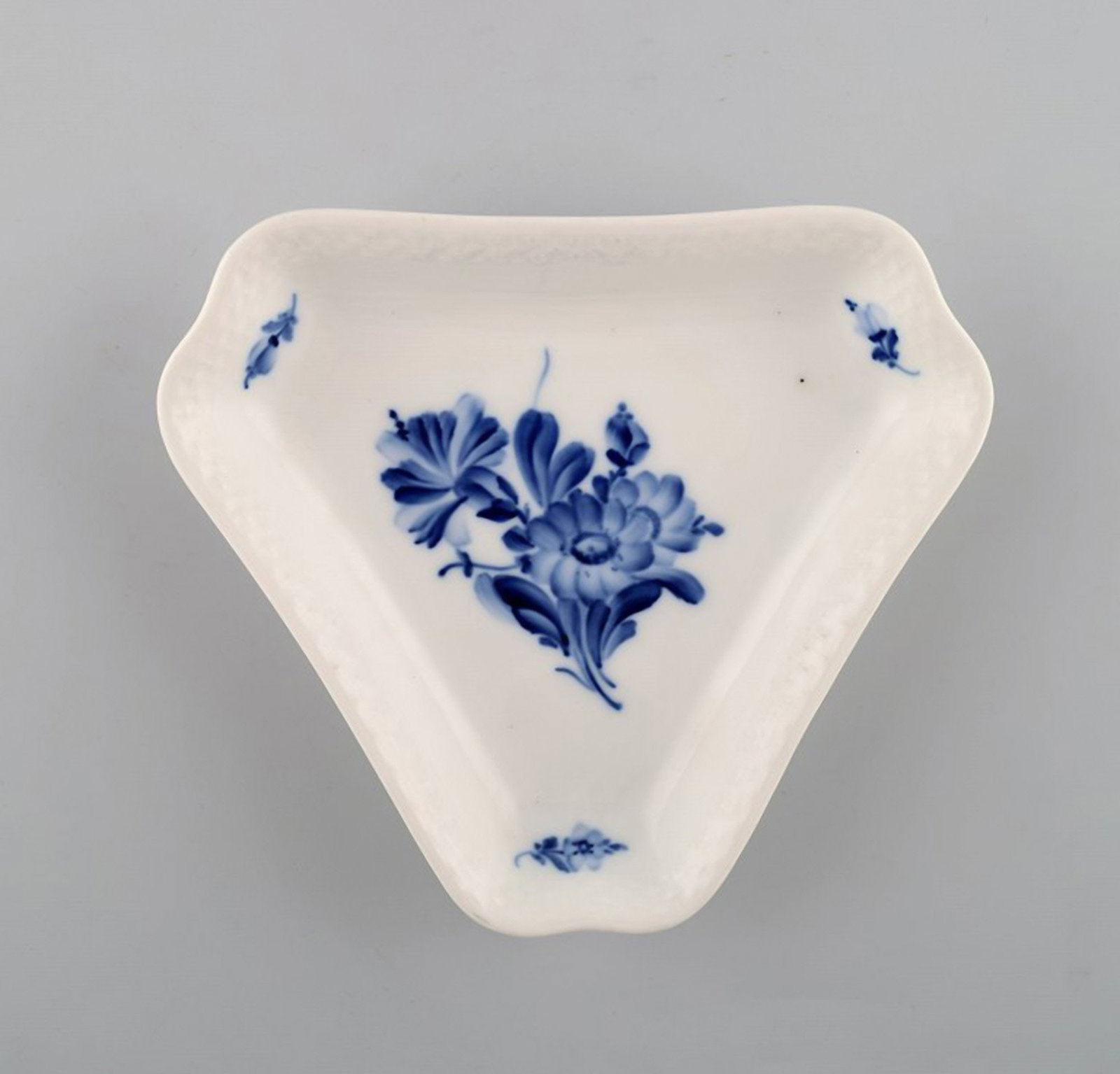 Blue flower braided triangular dish from Royal Copenhagen.: Title: Blue flower braided triangular dish from Royal Copenhagen. Description: Blue flower braided triangular dish from Royal Copenhagen. Stamped. Number 10/8278. 1st factory quality. In perfect condi