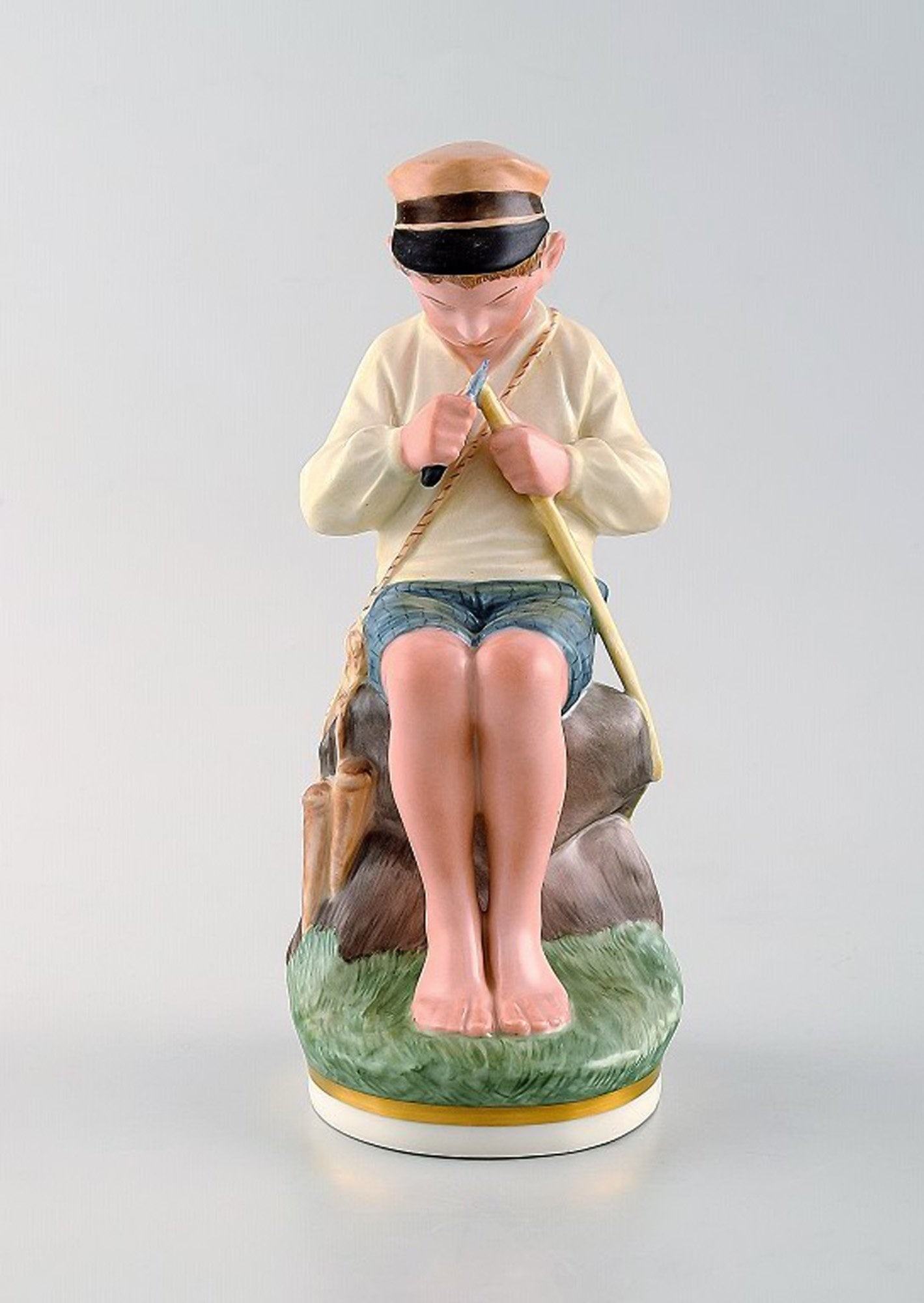 Royal Copenhagen porcelain figurine in high quality over glaze. Young boy. Model number 905. Dated (1 of 7)