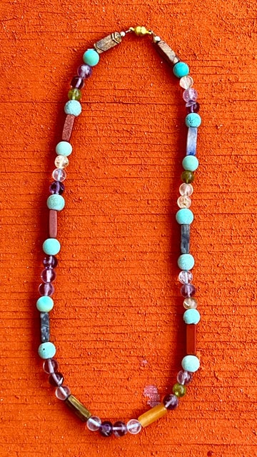 Beaded Necklace with Assorted Gemstones: Title:Beaded Necklace with Assorted Gemstones Description:Interesting Beads in round and bugle-shaped stones including Amazonite, Amethyst, Agates and Peridot. Magnetic Closer -16" long Reserve: $240.