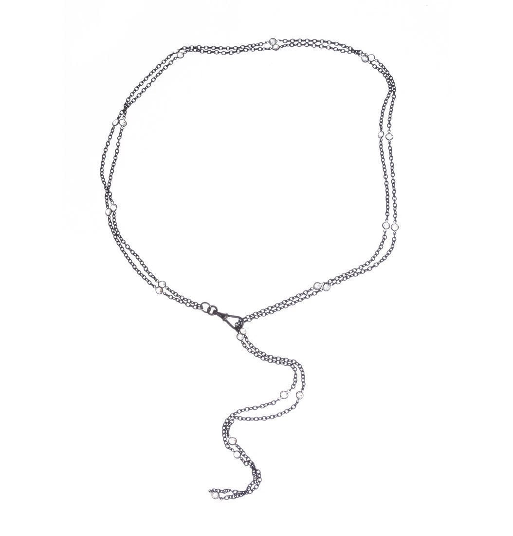 Art Deco Sterling Silver Rock Crystal Flapper Necklace: Title:Art Deco Sterling Silver Rock Crystal Flapper Necklace Description:Long sterling silver chain necklace separated with bezel set rock crystal. Circa, 1930’s. Necklace measures 63" long. Roc