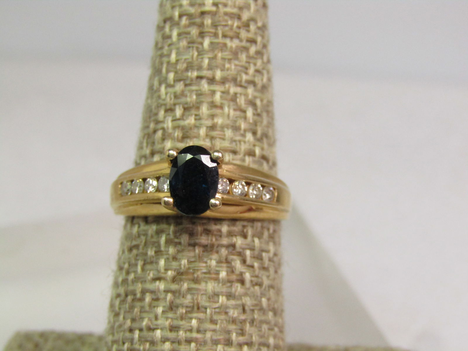 Vintage 14KT Blue Sapphire Diamond Ring, Sz. 7, 1980's: Title:Vintage 14KT Blue Sapphire Diamond Ring, Sz. 7, 1980's Description:Vintage 14KT Blue Sapphire Diamond Ring, Sz. 7, 1980's. This has a center raised oval prong-set dark blue sapphire that looks a