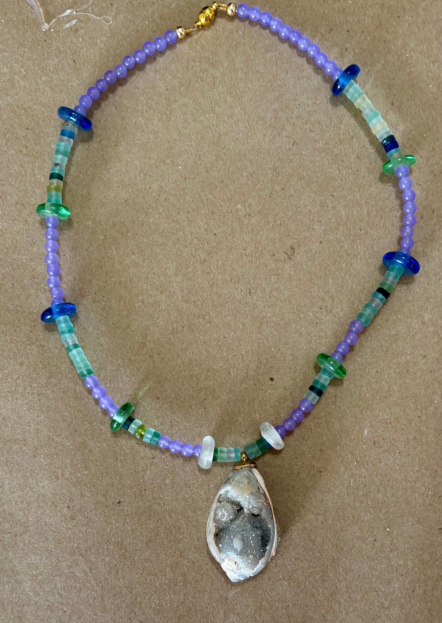 Orchid Onyx Necklace with a Fossil Pendant: Title:Orchid Onyx Necklace with a Fossil Pendant Description:Orchid-colored onyx pairs nicely with ancient Roman Glass Beads of green, aqua and blues. Yum. Pendant an unusual, crystallized fossil - ma