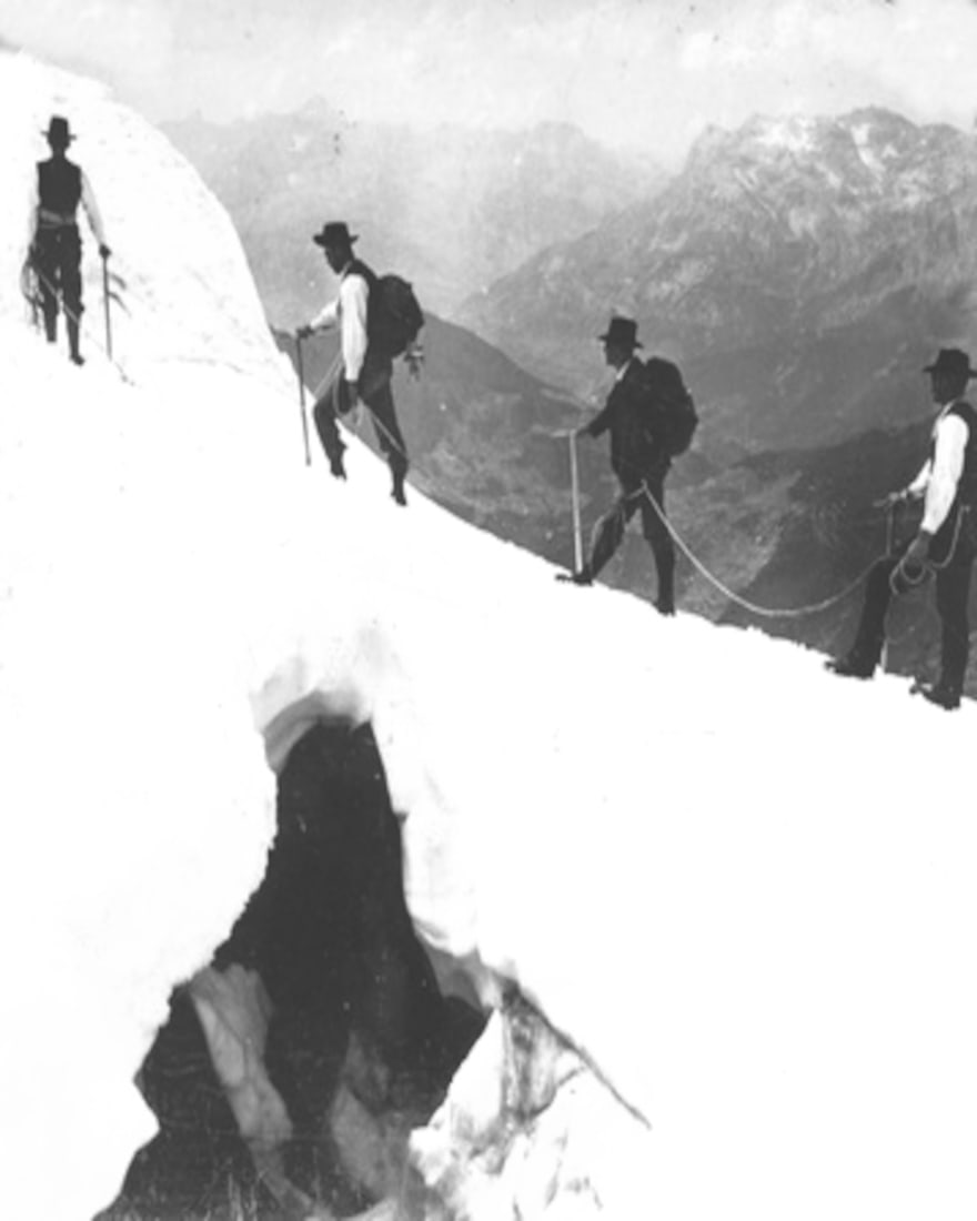 1908, Ascent of Mt. Blanc, crossing a dangerous crevasse on a snow bridge, Savoy Alps.: Title: 1908, Ascent of Mt. Blanc, crossing a dangerous crevasse on a snow bridge, Savoy Alps. Artist/Source: H.C. WHITE CO. Original Date: SEE TITLE Dimensions: 10X8 Description: || UNITED STATES SHIP