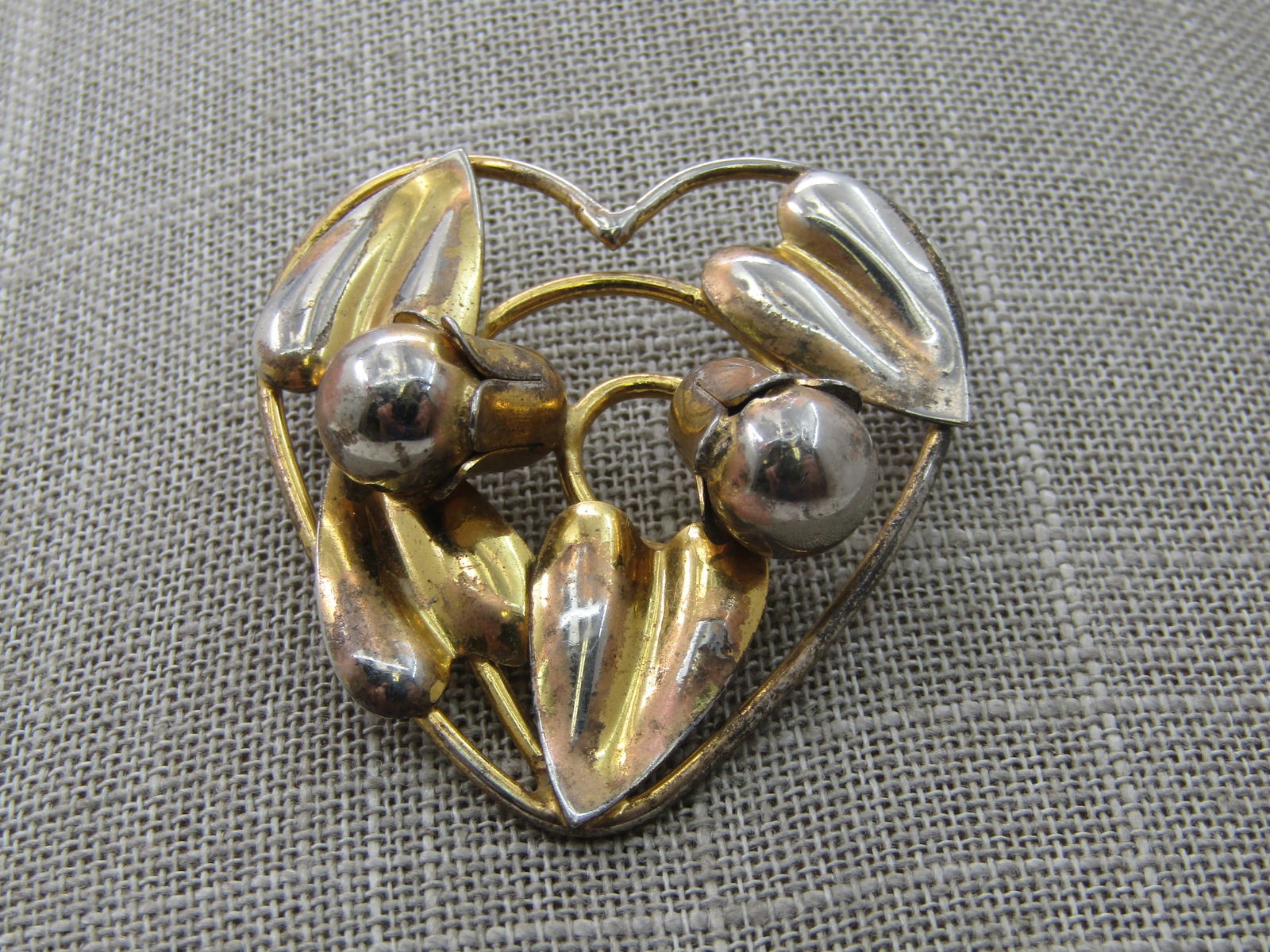 Vintage Sterling Heart Leaf Brooch, Signed. 1940's-1950's, 2": Vintage Sterling Heart Leaf Brooch, Signed. 1940's-1950's, 2" tall and appx. 1.75" wide, open areas with leaves and two pod-like blossoms. Signed what looks like ND Barch or Barclu. Good condition wit
