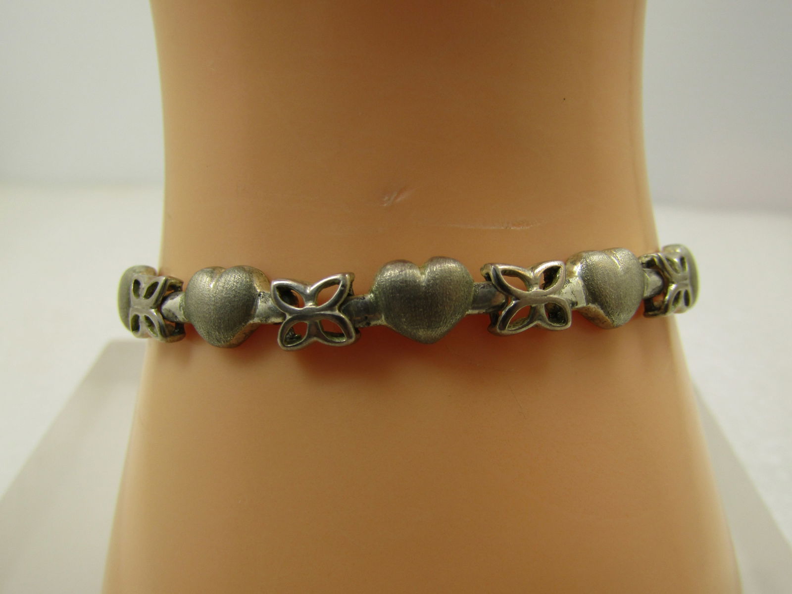 Vintage Sterling Heart & Butterfly Link Bracelet, 7", 1980's-1990's: Vintage Sterling Heart & Butterfly Link Bracelet, 7", 1980's-1990's. This bracelet is marked .925 and FAS (fused alloy silver). It tests as sterling with a weight of appx. 12.94 grams. FAS means, fuse