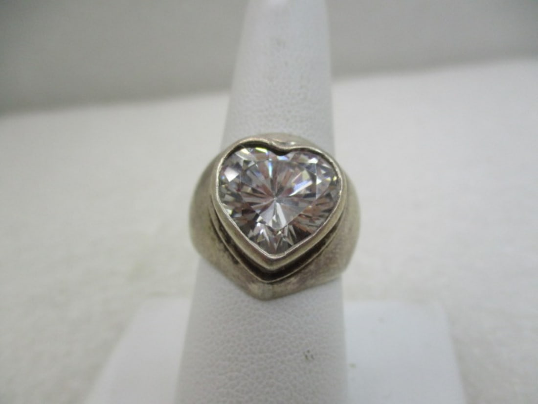 Vintage Sterling Silver Heart CZ Ring, Chunky, Sz. 8 (L): Vintage Sterling Silver Heart CZ Ring, Chunky, Sz. 8. Appx. Weight is 10.66 grams. Raised bezel-set heart cz clear stone. Appx. 15mm high and 14mm wide. It is appx. 19mm down the finger and covers the