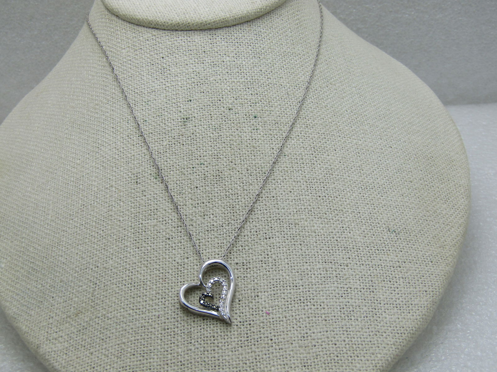 Vintage Sterling Silver Heart Necklace, Illusion Setting, 20": Vintage Sterling Silver Heart Necklace, Illusion Setting, 20", This has the look of black and white dimonds but there is only one white diamond chip. The illusion setting has prong-like bumps with a f