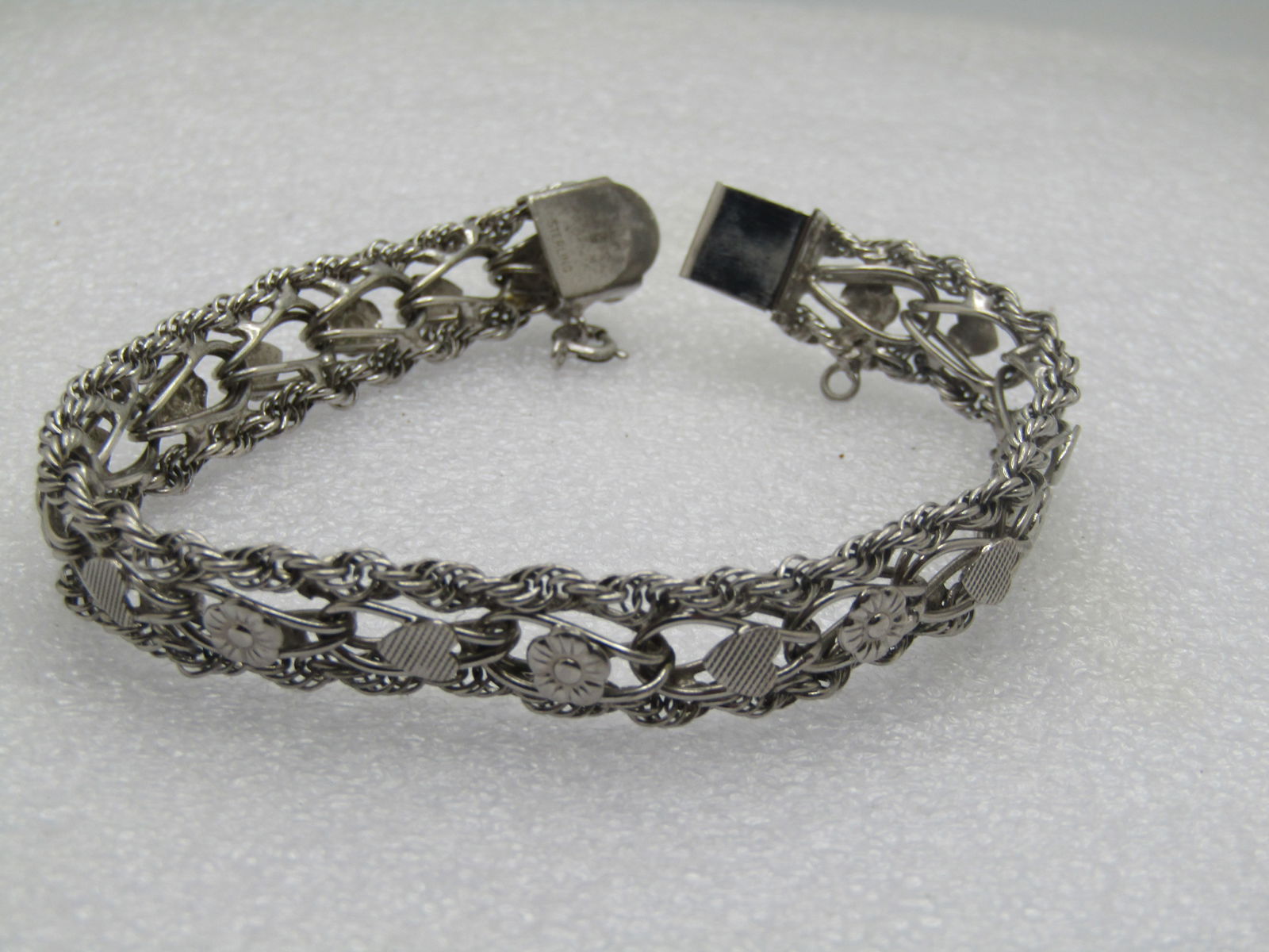 Vintage Sterling Hearts & Flowers Wide Bracelet, 7.5", Signed R, 1970's: Vintage Sterling Hearts & Flowers Wide Bracelet, 7.5", Signed R, 1970's. This is appx. 10.5mm wide with a box clasp where it is signed R and marked sterling. It has an anti-tarnish plating, likely rho