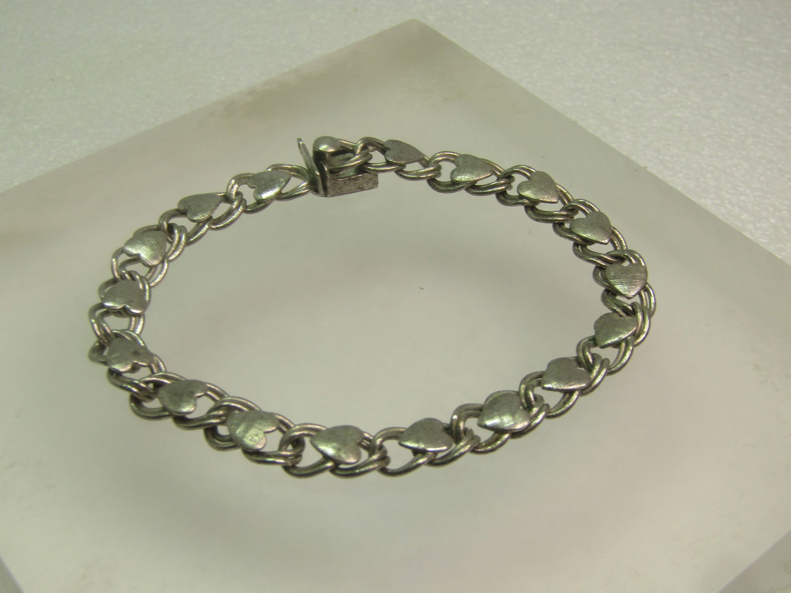 Vintage Sterling Heart Charm Bracelet, Double Link , 7", 1950's-1960's, Beau Sterling: Vintage Sterling Heart Charm Bracelet, Double Link , 7", 1950's-1960's, Beau Sterling. This is a double link bracelet that is appx. 7mm wmide with a box clasp and textured heart accents on the top of