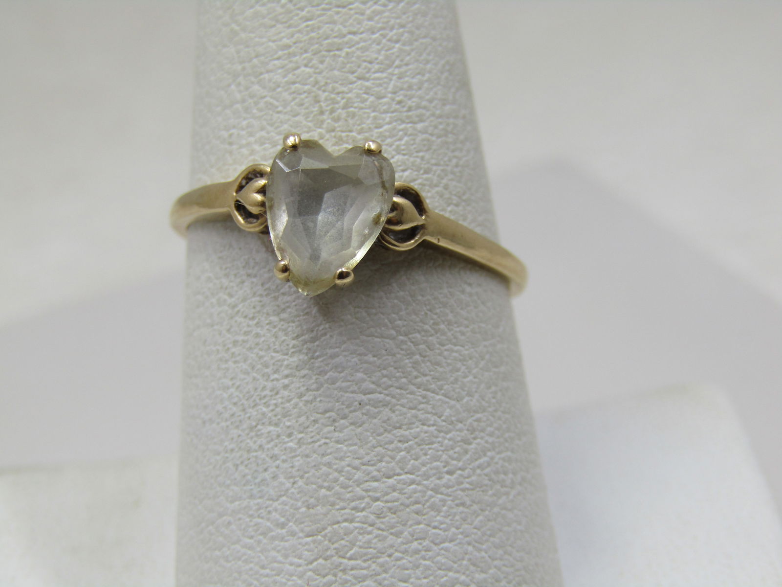 Vintage 10kt White Topaz Heart Ring, Sz.9, Signed: Vintage 10kt White Topaz Heart Ring, Sz. 9, Signed with an unknown maker's mark and marked 10kt and tested. Weight of the ring is appz. 1.54 Gr. The maker's mark is a circle with marking inside it tha
