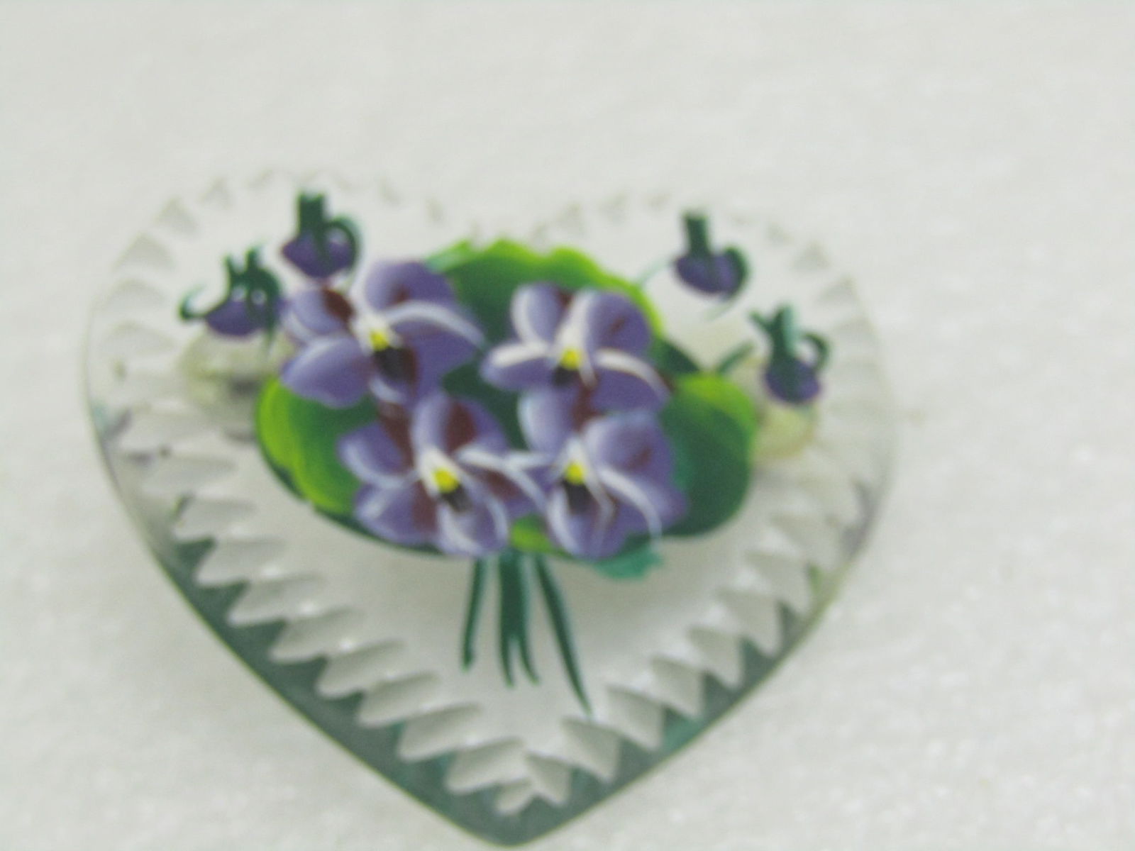 Vintage Lucite Heart Painted Violets Brooch: Vintage Hand Painted Violets Heart Brooch, clear lucite notched heart. Purple, white, green. Circa 1960's. Appx 1.7" tall, almost 1.8" wide. Very good condition. Inv.W.6.299.6.AUC.11.10 SS5327 J LD 7/