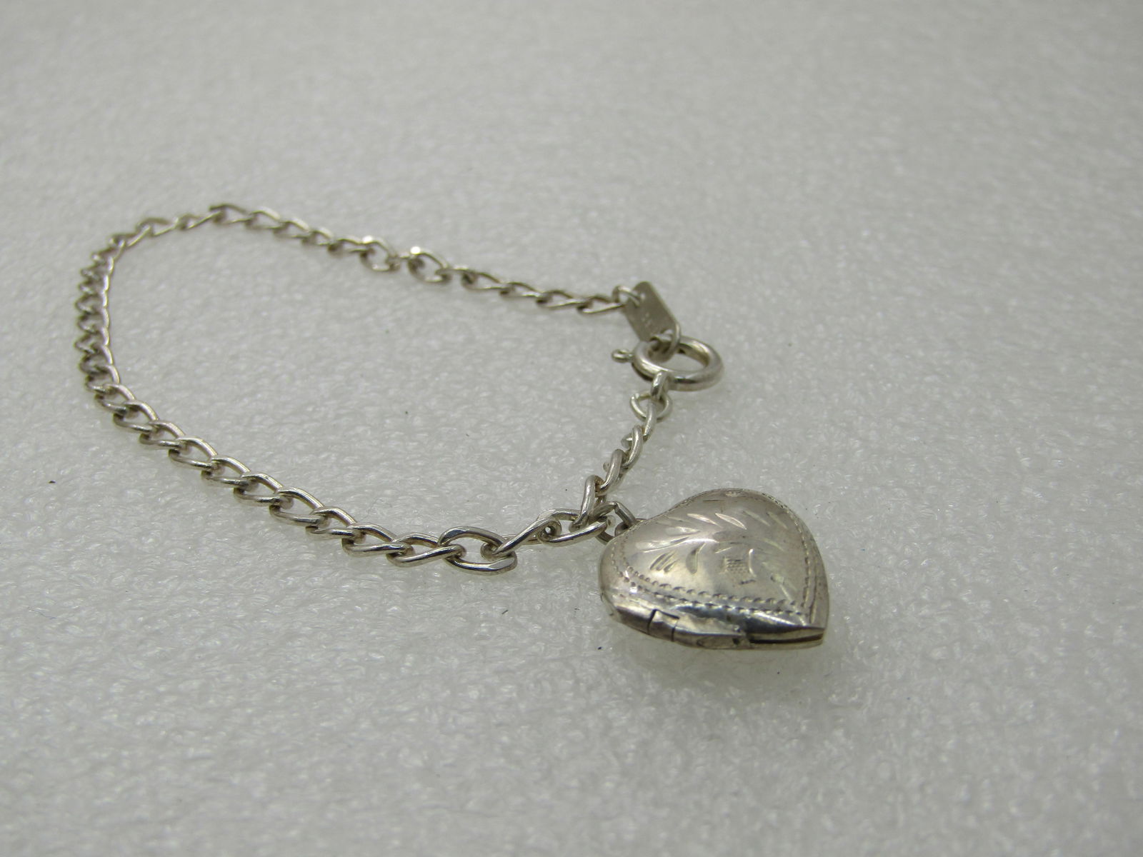 Vintage Sterling Silver Heart Locket Bracelet, 7.25", Signed MA - Marsala: Vintage Sterling Silver Heart Locket Bracelet, 7.25", Signed MA, hinged heart that is appx. 3/4" by 5/8", bracelet weighs appx. 5.39 grams. 3mm wide chain with large spring clasp. Very good condition,