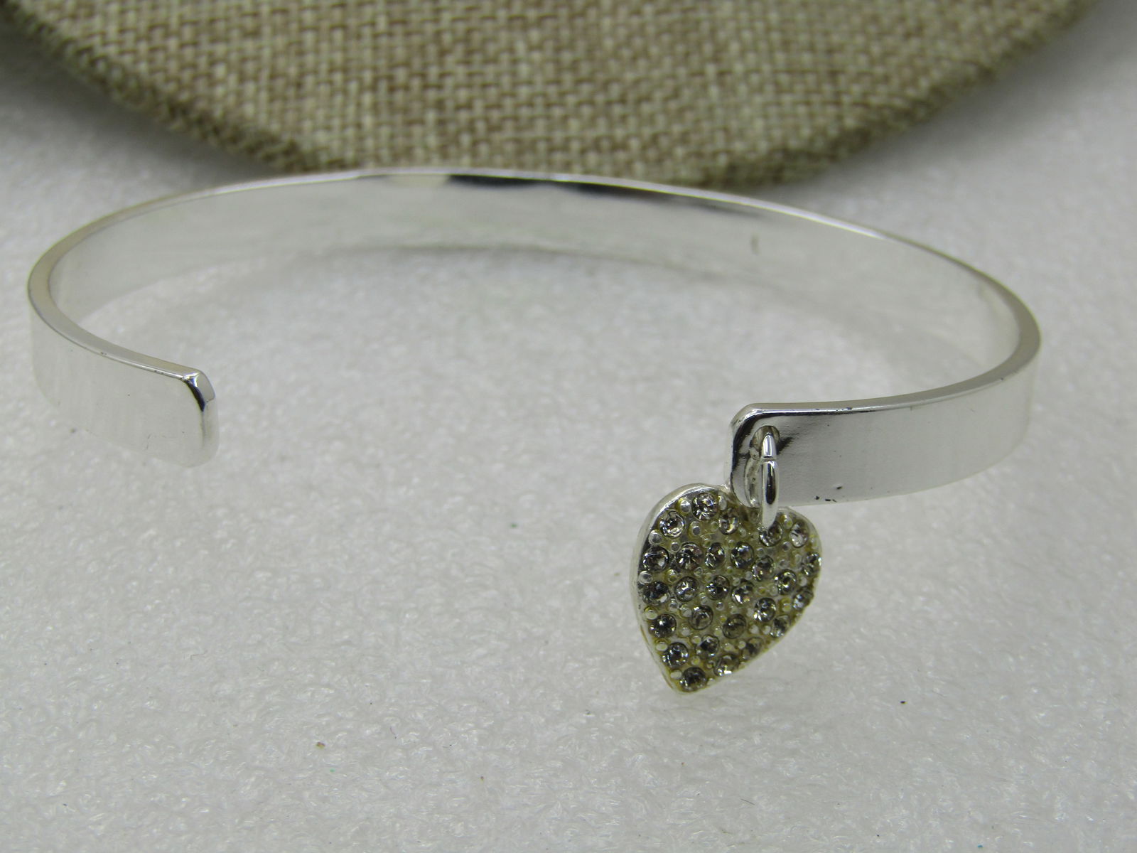 Avon Follow Your Heart Your Heart Cuff Bracelet, 7.25", New in Box: Avon Follow Your Heart Your Heart Cuff Bracelet, 7.25", Dangle pave-set heart charm on the end at opening, Product title is My Truth Charm Bracelet Heart, New in Box. Came from a seller who retired. P