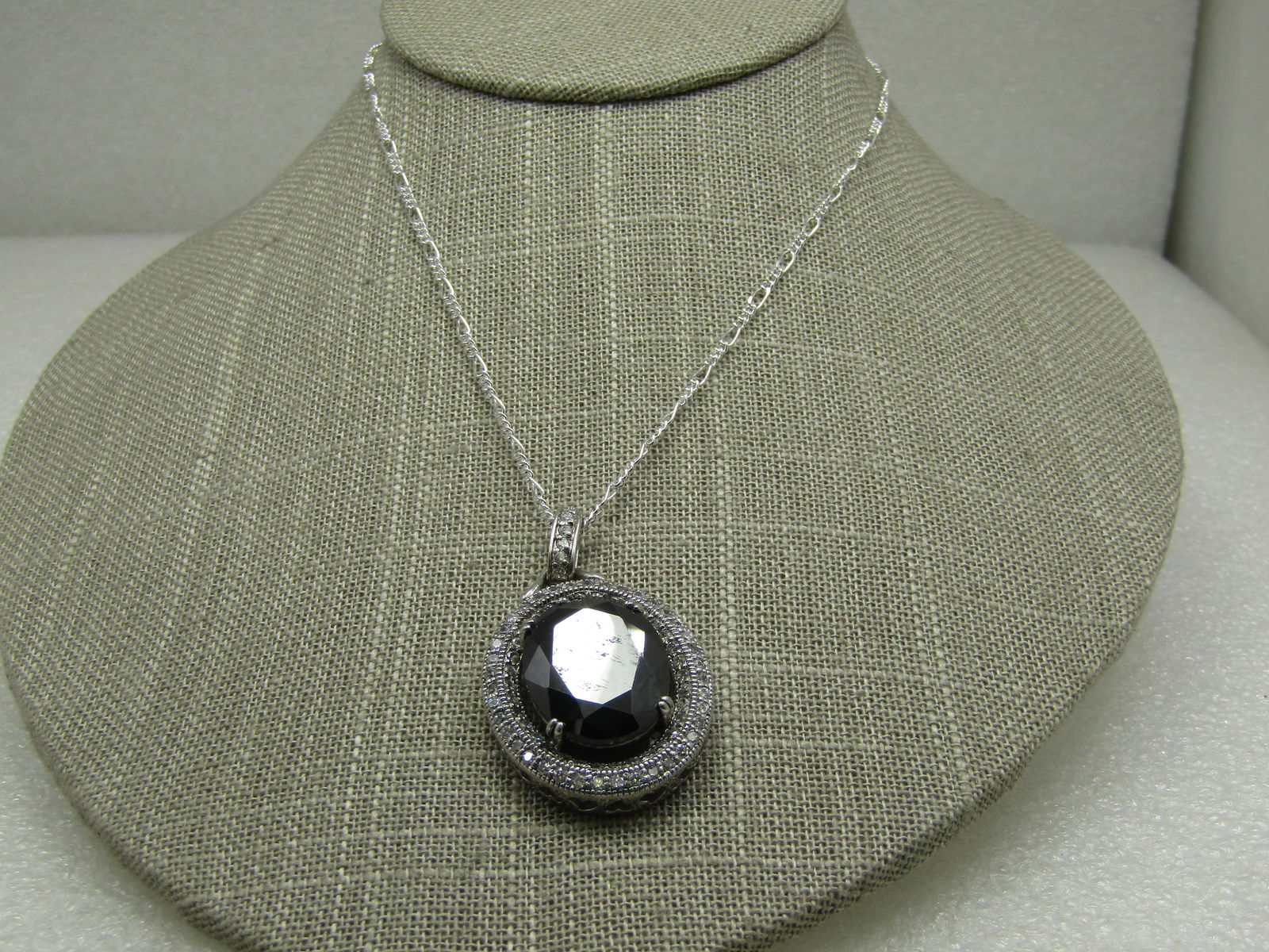 Sterling Silver Faux Hematite & Rhinestone Halo Necklace, 20" Heart Accents.: Sterling Silver Black & Rhinestone Halo Necklace, 20" and 2.5mm wide figaro chain. Heart accents. The pendant is marked .925 and tests as sterling,. appx. 16.50 gr. The pendant has a 20mm by 16mm oval