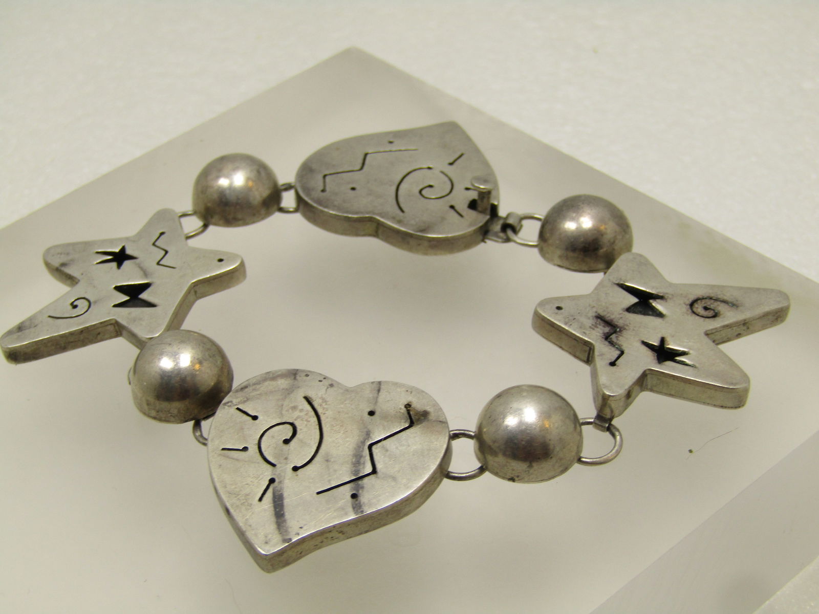 Vintage Sterling Hearts & Stars Bracelet, Thick Links 7" Signed Far Fetched, 1980's: Vintage Sterling Hearts & Stars Bracelet, Thick Links 7" Signed Far Fetched, 1980's. Far Fetched is a jewelry company, founded by Richard Wolf in the 1980s, known for its fun, heartfelt, and culturall