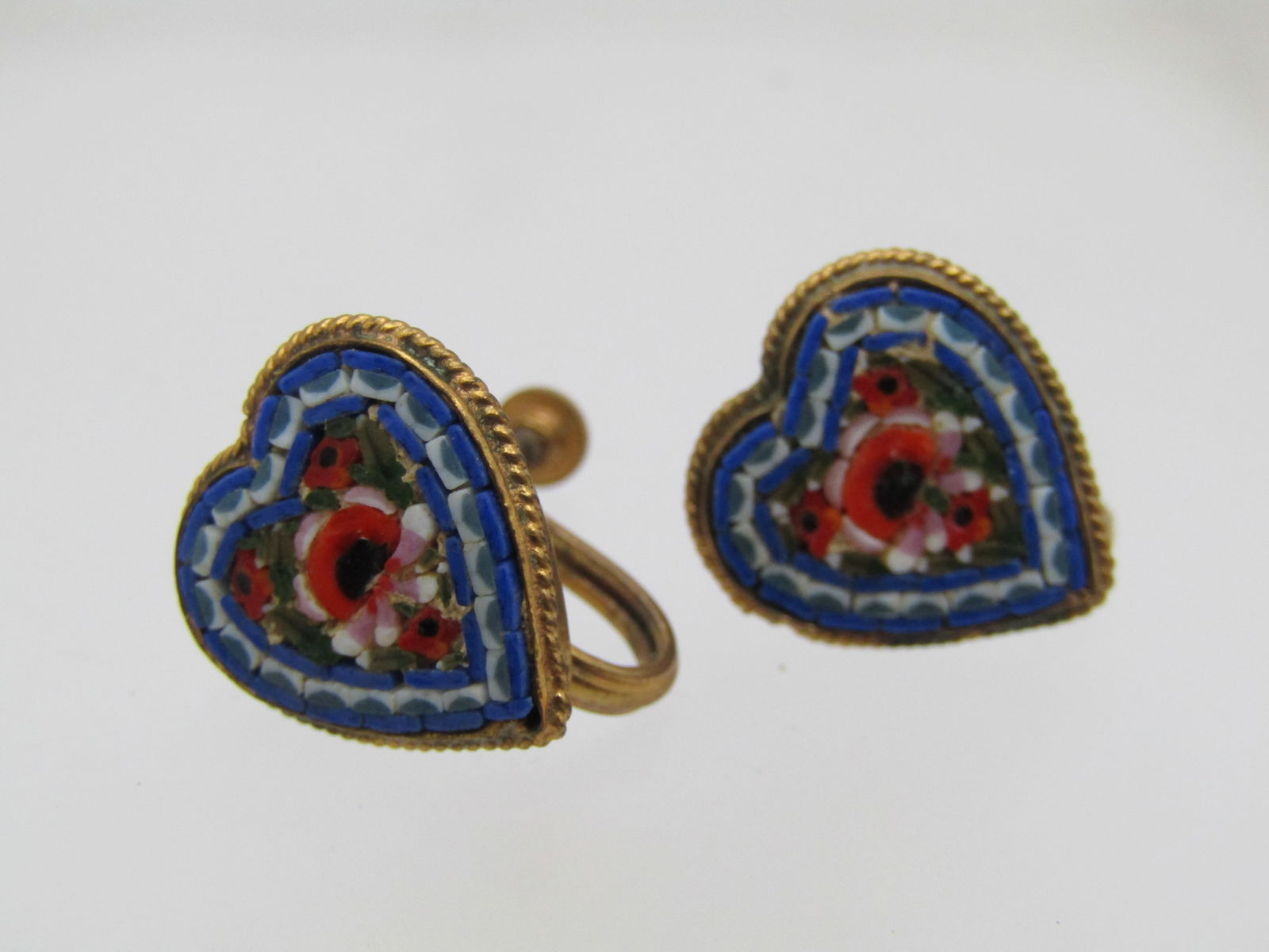 Vintage Micromosaic Heart Earrings, Screwback, 1950's-1960's, Signed FAP Italy: Vintage Micromosaic Heart Earrings, Screwback, 1950's-1960's. They are a gold tone screw back and have a rope accent frame and bezel-setting around the hearts that are made of glass mosaic pieces in r