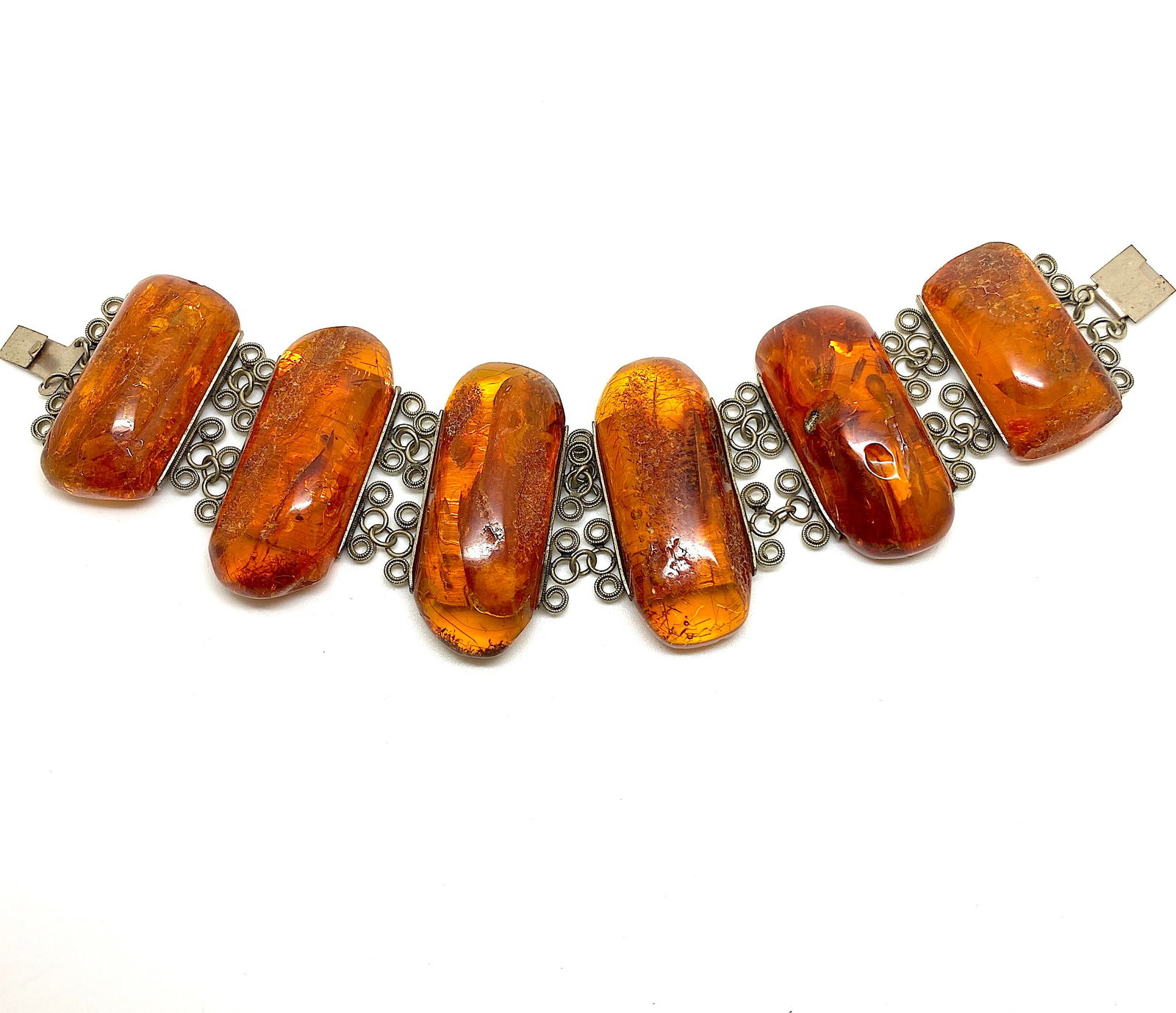 Alluring Amber Bracelet made from Rectangle shaped Amber beads: Title:Alluring Amber Bracelet made from Rectangle shaped Amber beads Metal:None Gemstone:Amber Weight:70.8 g Size:Size: 210.0 x 50.0 x 13.0 mm Size: 8.268 x 1.969 x 0.512 inches Bead size: 21.0 x 47.5