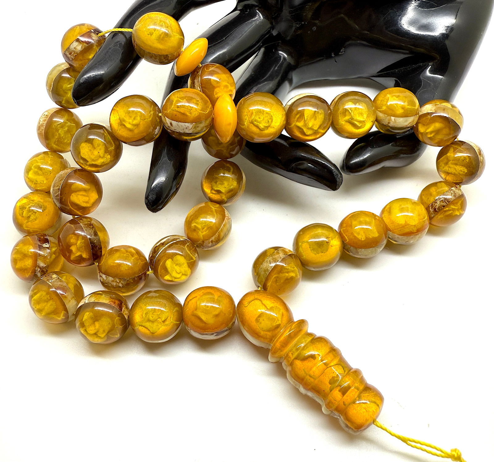 Unique and Fascinating Amber Tesbih made from Round Amber beads: Title:Unique and Fascinating Amber Tesbih made from Round Amber beads Metal:None Gemstone:Amber Weight:50.0 g Size:Bead size: 14.0 mm Bead size: 0.551 inches Made of:(Reconstituted Amber or Whole Ston