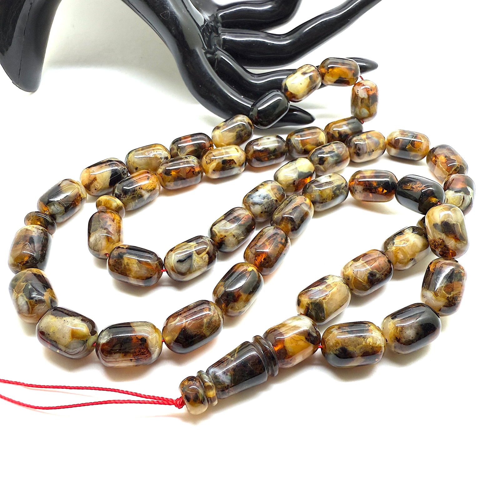 Unique and Outstanding Amber Tesbih made from Barrel shaped Amber beads: Title:Unique and Outstanding Amber Tesbih made from Barrel shaped Amber beads Metal:None Gemstone:Amber Weight:62.2 g Size:Bead size: 16.0 x 11.0 mm Bead size: 0.63 x 0.433 inches Made of:(Reconstitut