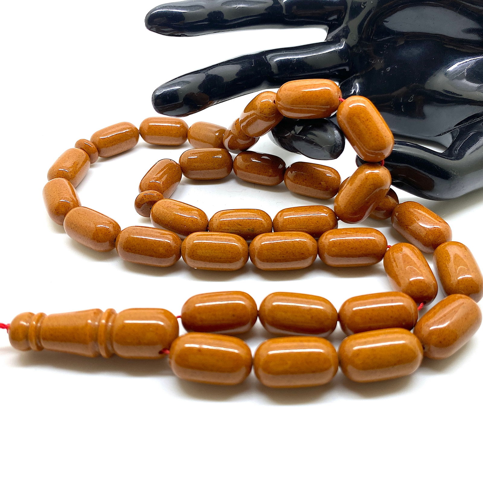 Antique Amber Tesbih made from Capsule shaped Amber beads: Title:Antique Amber Tesbih made from Capsule shaped Amber beads Metal:None Gemstone:Amber Weight:41.6 g Size:Bead size: 18.0 x 10.0 mm Bead size: 0.709 x 0.394 inches Made of:(Reconstituted Amber or W