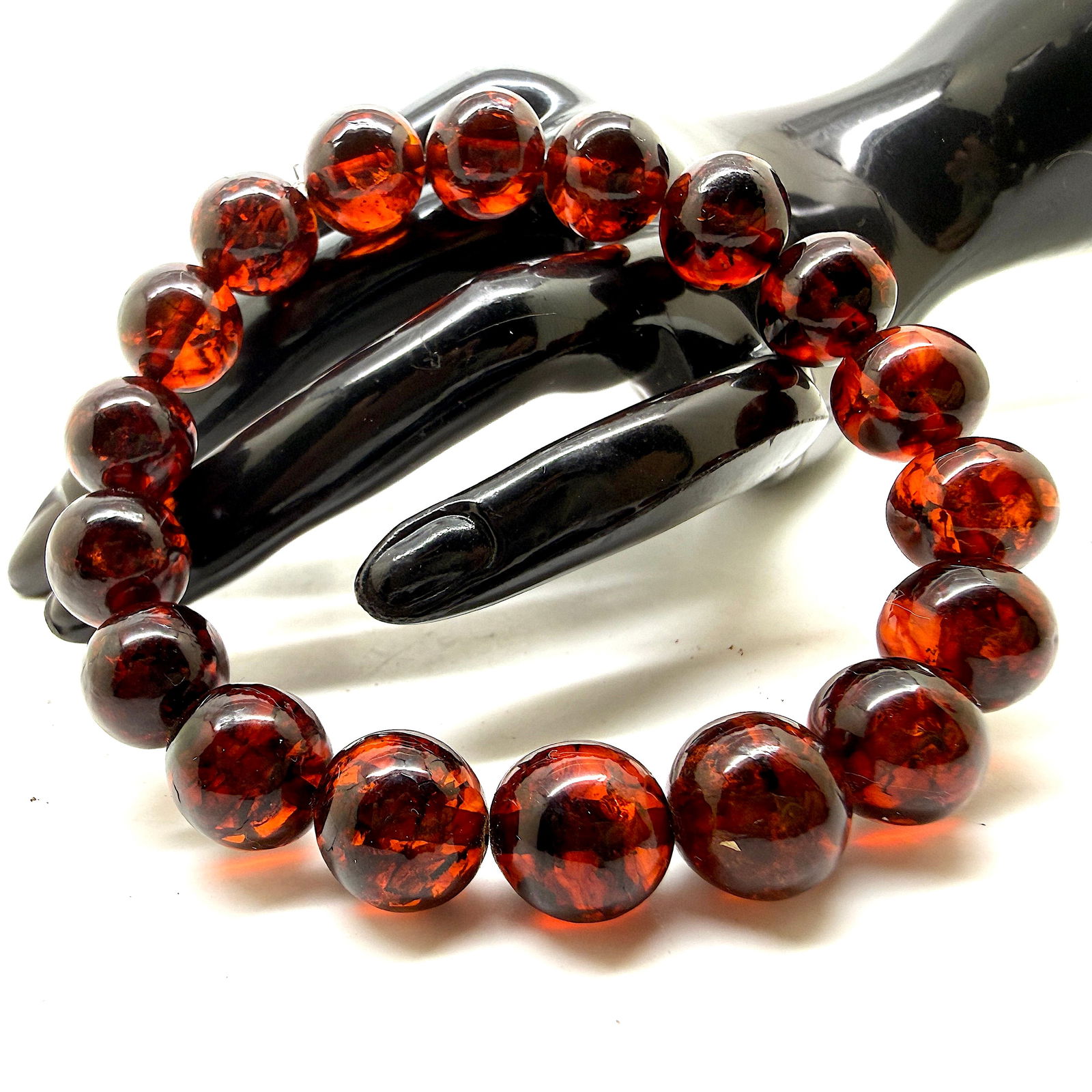 Staggering Amber Bracelet made from Round Amber beads: Title:Staggering Amber Bracelet made from Round Amber beads Metal:None Gemstone:Amber Weight:17.5 g Size:Bead size: 12.0 mm Bead size: 0.472 inches Made of:(Reconstituted Amber or Whole Stone):Reconst