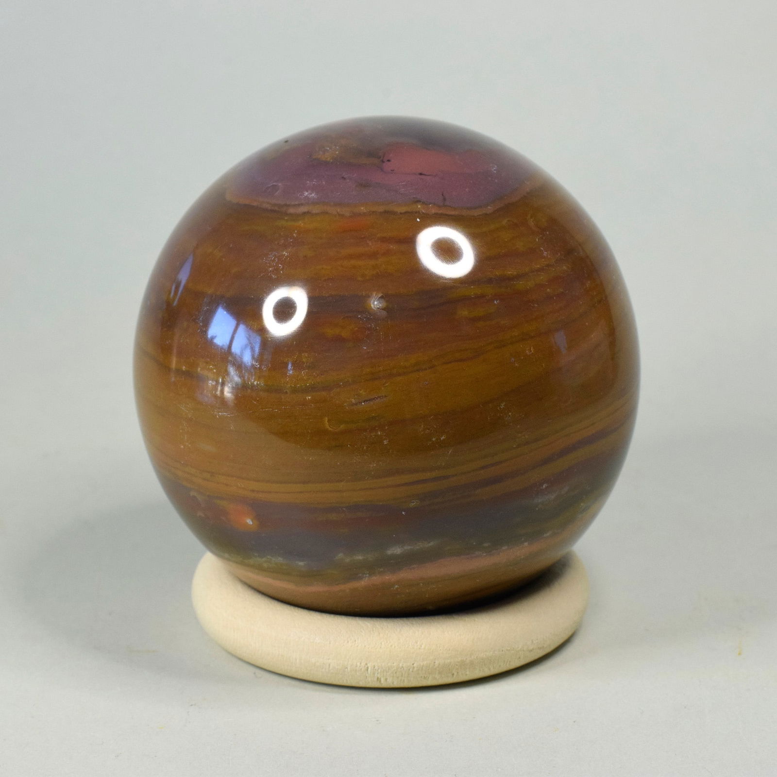 6.9 cm Polished Ocean Jasper sphere: Title: 6.9 cm Polished Ocean Jasper sphere Origin: Madagascar Size: 6.9 cm diameter Description: Fine polished Ocean Jasper sphere. Beautiful color shades. Very decorative. The stand is included in th