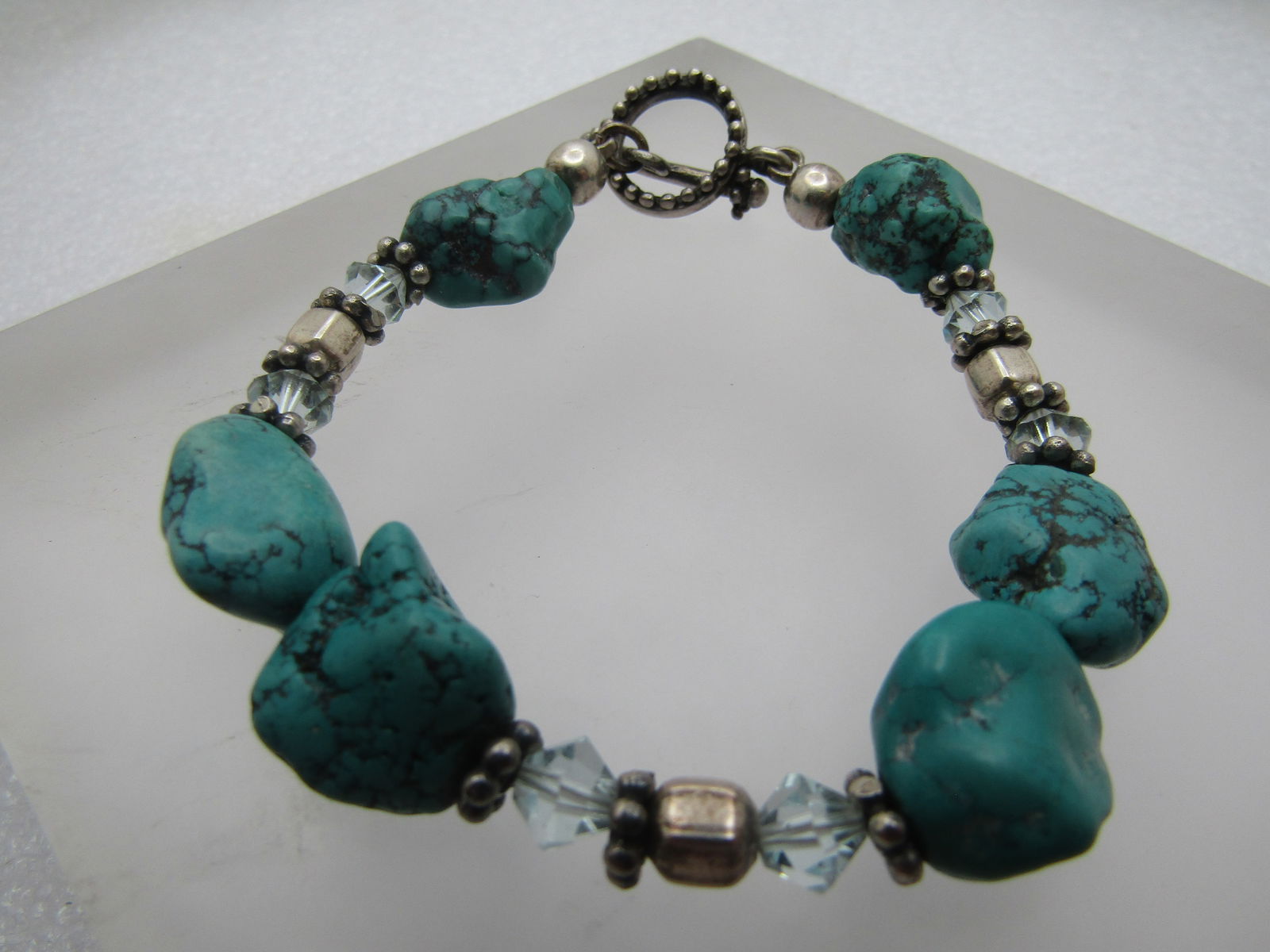 Vintage Sterling Southwestern Turquoise & Crystal Bracelet, 7.75",: Vintage Sterling Southwestern Turquoise & Crystal Bracelet, 7.75", Toggle Clasp. The nuggets do have that dyed look and could be something other than turquoise. There are six nuggets that are appx. 11