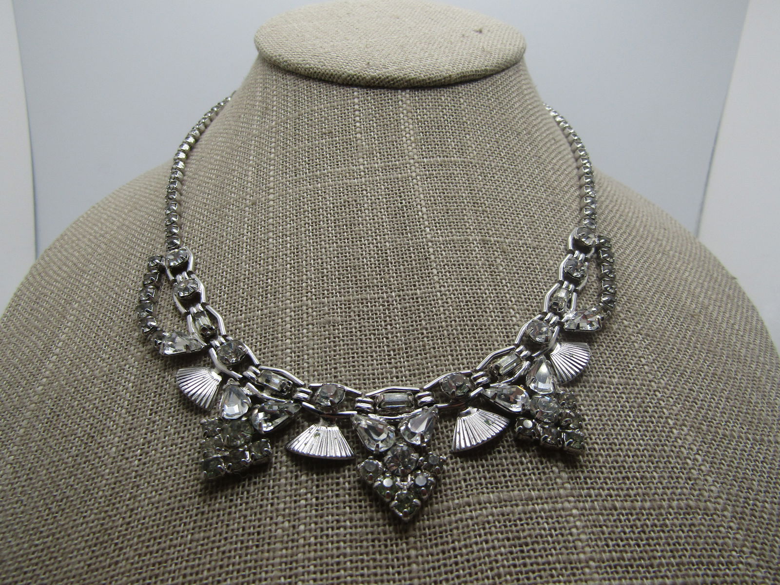 Vintage Rhinestone Art Deco Themed Necklace, 16", 1940's-1960's: Vintage Rhinestone Art Deco Themed Necklace, 16", 1940's-1960's. Silver tone. This has an all rhinestone chain that changes as it goes around the neck. At the front is has a framed link with center ro