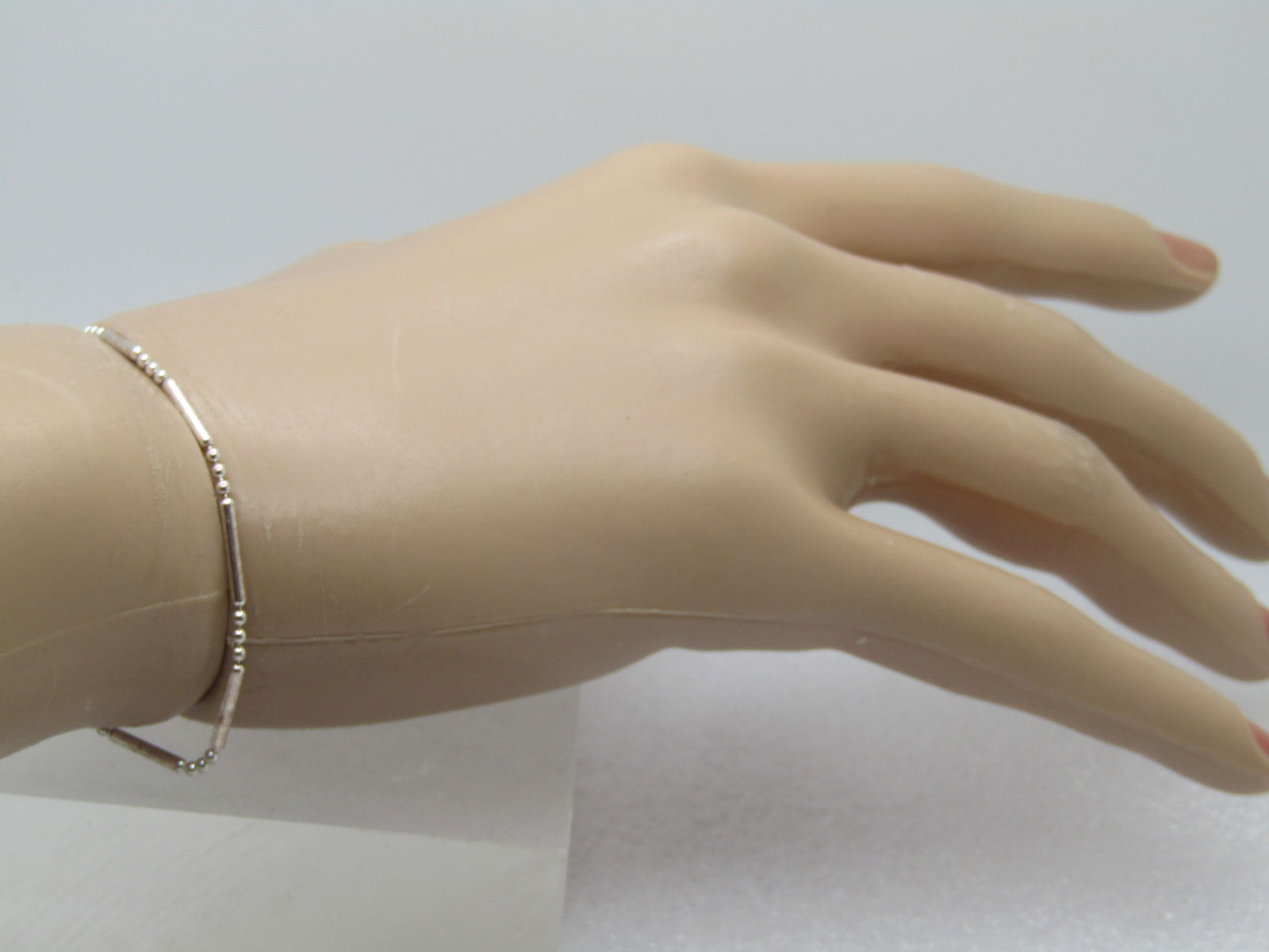 Sterling Bar & Ball Link Bracelet, 7.5", Italy , 1990's. Unisex: Sterling Bar & Ball Link Bracelet, 7.5", Italy , 1990's. Unisex. It is marked .925, spring clasp. It is an appx. width of 1.5mm. It has a mild magnetic reaction but tests as sterling - it is likely a