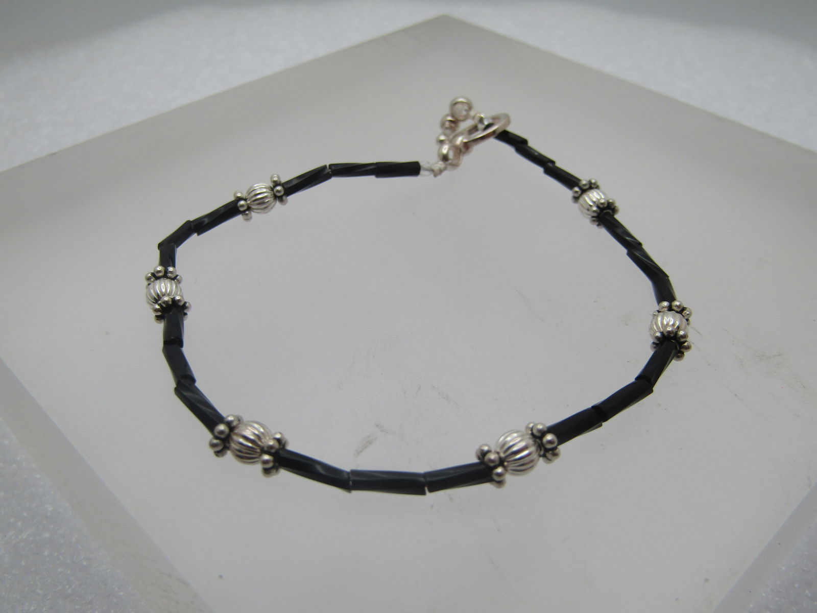 Vintage Sterling Black & Silver Beaded Bracelet, 7.5", Southwestern, 1980's-1990's: Vintage Sterling Black & Silver Beaded Bracelet, 7.5", Southwestern, 1980's-1990's. Black twisted straw beads with fluted and beaded silver beads and a lobster clasp. It is marked .925 on the ring of