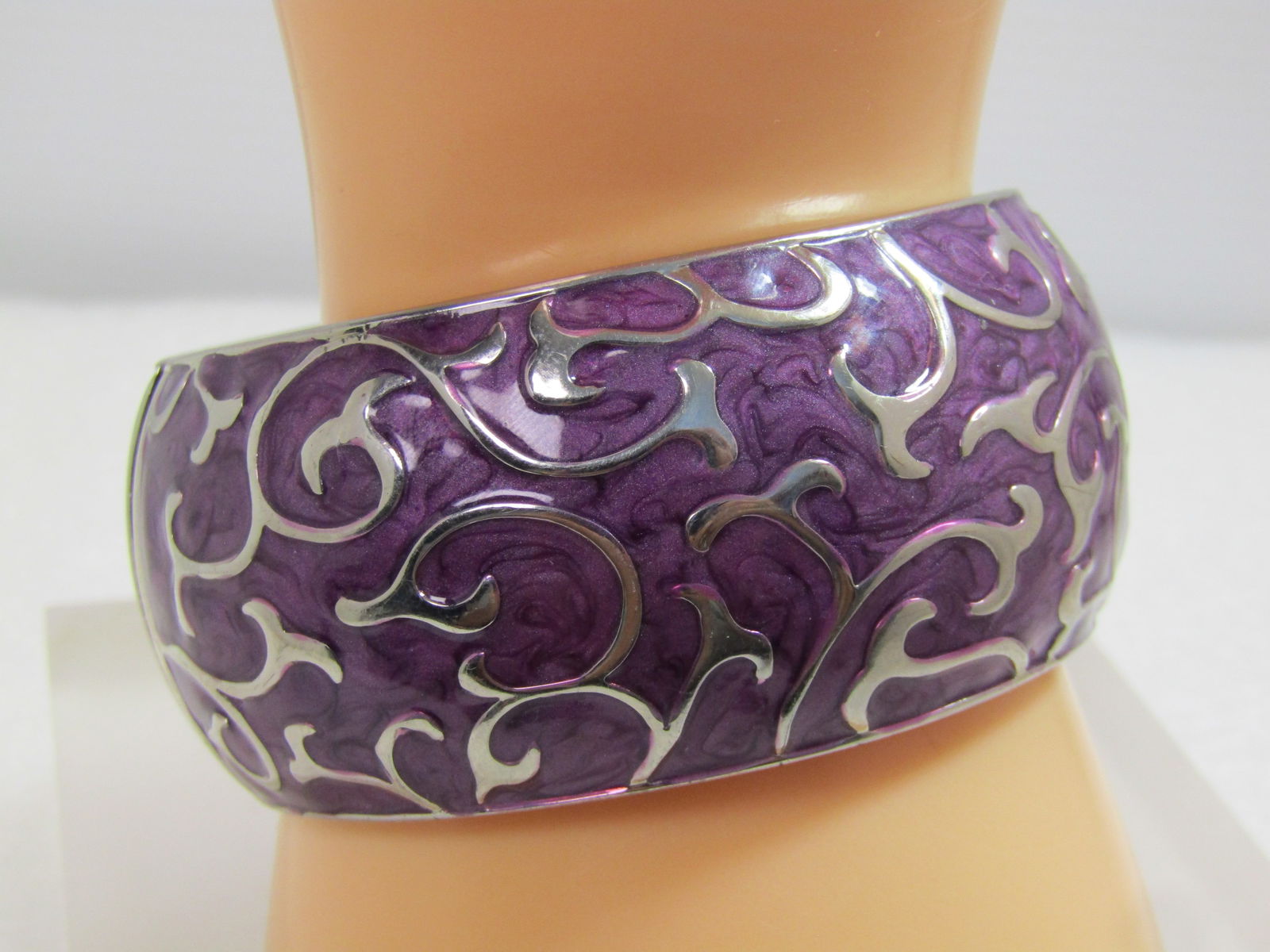 Vintage Purple Enameled Scrolled Hinged Bracelet, 7", 1980's: Vintage Purple Enameled Scrolled Hinged Bracelet, 7", 1980's. This is domed outward with a textured silver tone finish inside. The opening is r ound and appx. 2-1/3" wide. It is appx. 1.25" wide. Very