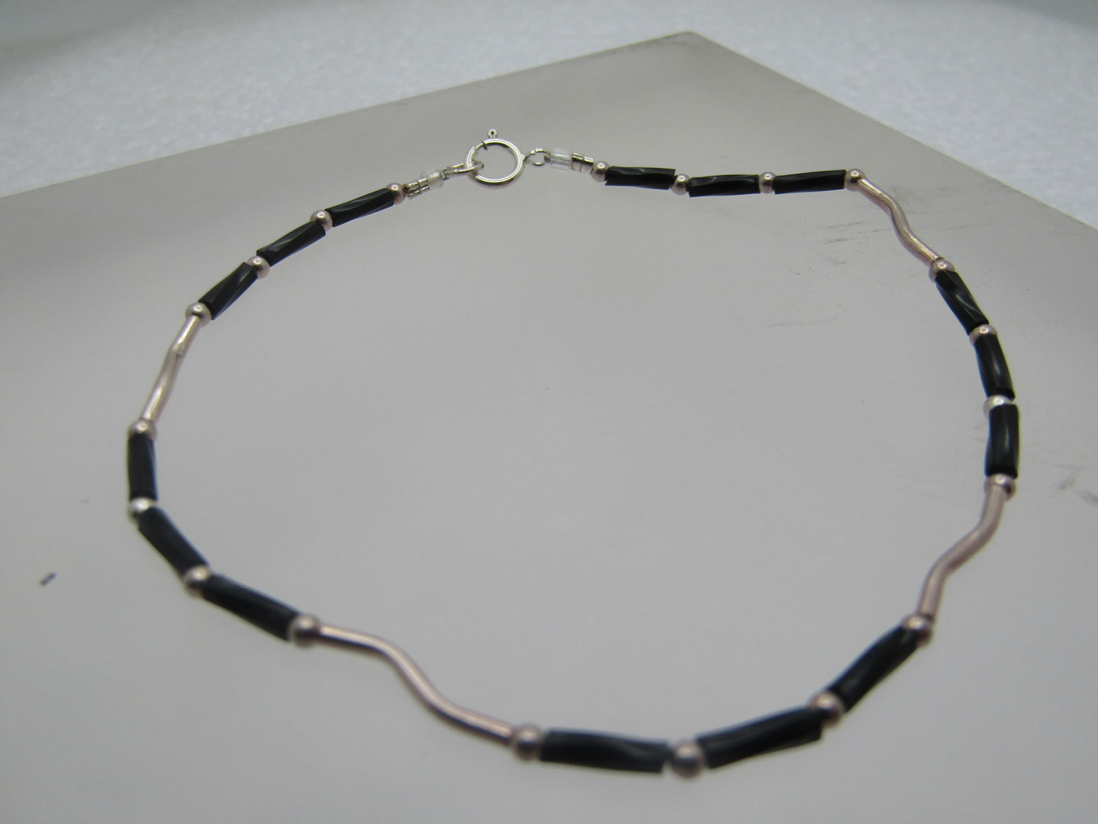 Vintage Sterling Black Beaded Bracelet, 8", Southwestern, 1980's-1990's: Vintage Sterling Black Beaded Bracelet, 8", Unisex. Southwestern, 1980's-1990's. This has black twisted straw beads - onyx or glass - not sure with stering curved beads and round beads. It is marked .