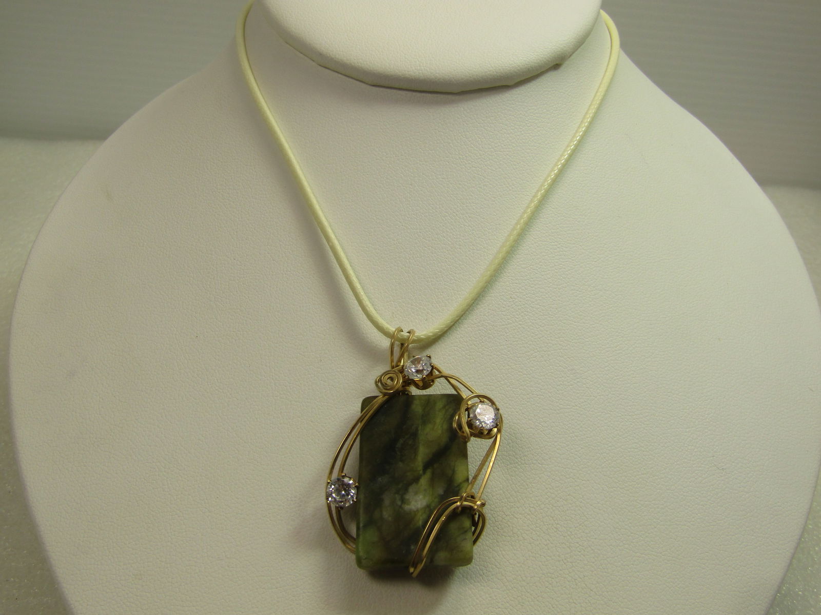 Vintage Wrapped Green Quartz Necklace, Rhinestone, 1980's-1990's, 18"-20": Vintage Wrapped Green Quartz Necklace, Rhinestone, 1980's-1990's, 18"-20", The agate is wrappedwith two strands of gold filed wire around the rectangular stone with three clear rhinestones that are pr