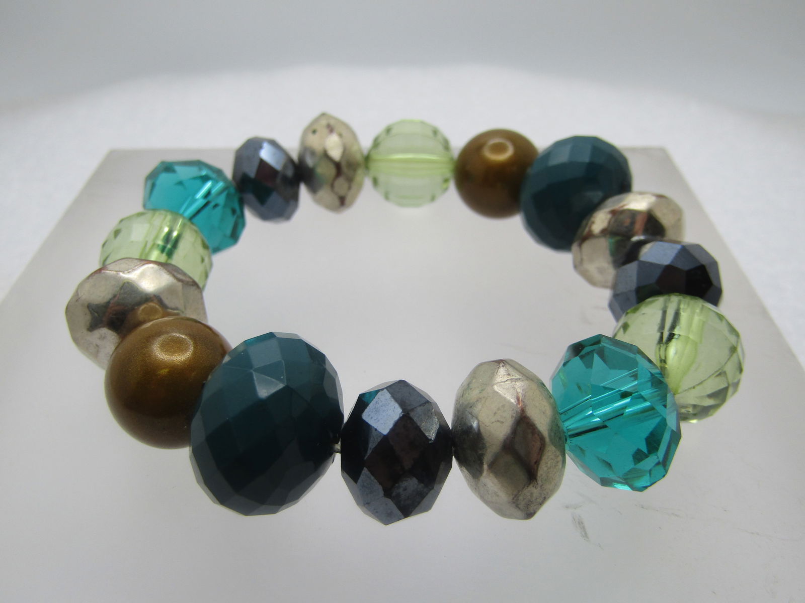 Green, Silver Black Beaded Stretch Bracelet, Chunky, 1980's-1990's, Fits up to 7": Green, Silver Black Beaded Stretch Bracelet, Chunky, 1980's-1990's. Stretch up to 7". The beads range in width from 11mm to 16.5mm and are in a forest green and a emerald green color to pale ygreen, m