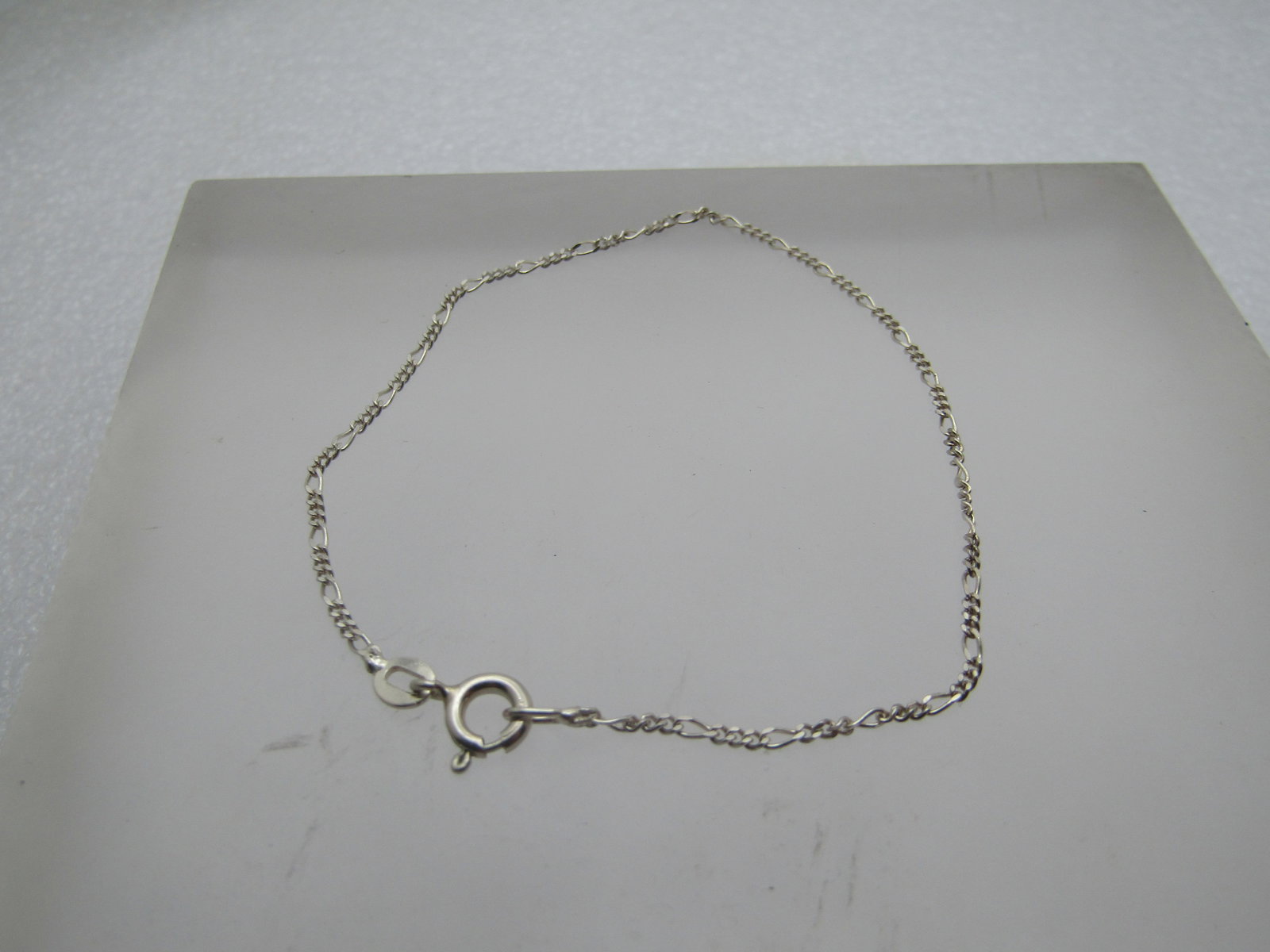 Sterling Silver Figaro Link Bracelet, 1.2mm, 7.5", 2000's, Signed.: Sterling Silver Figaro Link Bracelet, 1.2mm, 7.5", 2000's. A modern sterling bracelet that is marked .925 and tests as sterling with a weight of appx. 1.07 gr. Spring clasp, signed BY. Very clean and