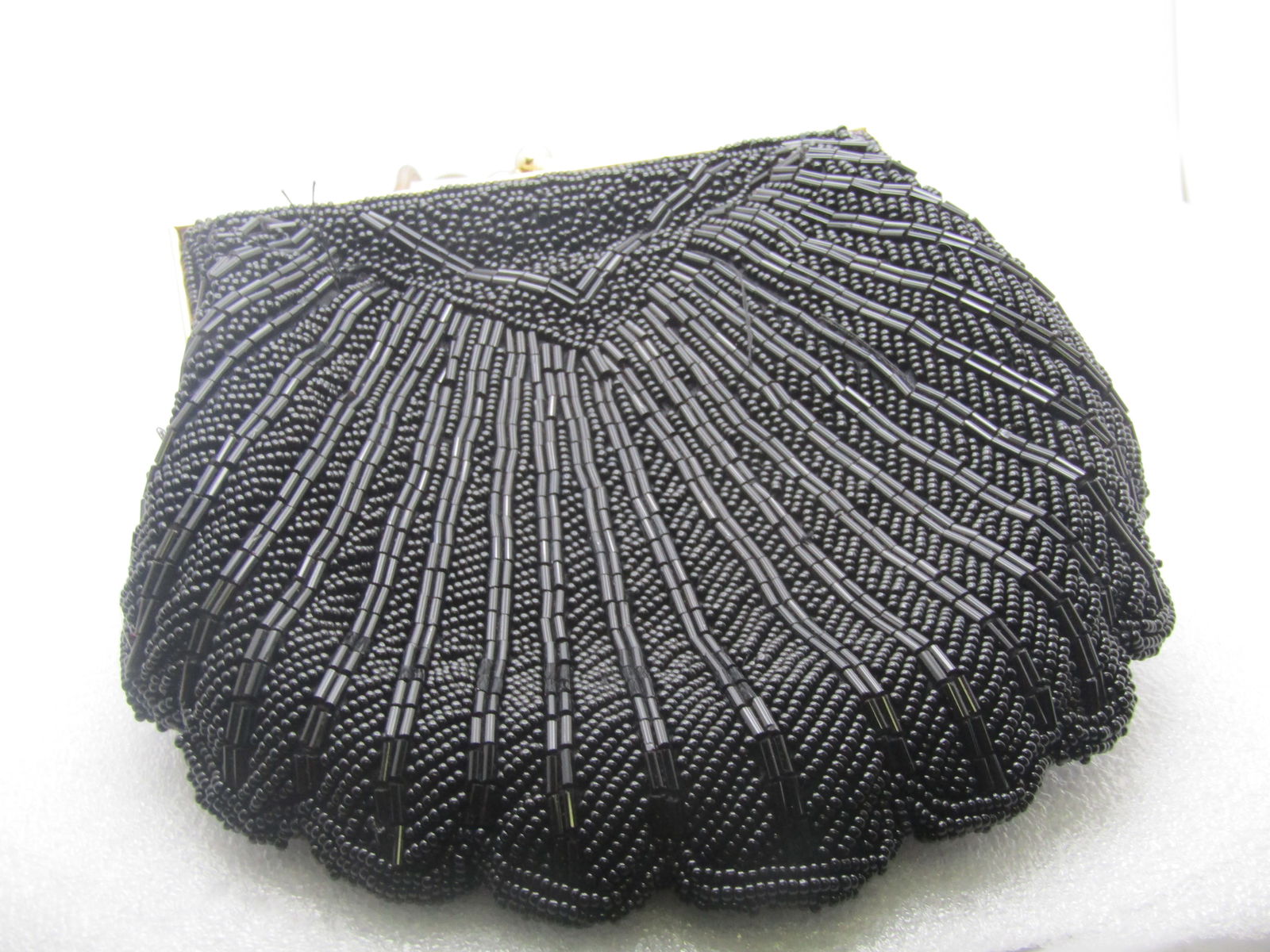 Vintage Black Beaded Shell Shaped Purse. 1980's or Earlier, Evening Bag or Clutch.: Vintage Black Beaded Shell Shaped Purse. 1980's or Earlier. Evening bag or clutch, the handle can drop inside the purse to use as a clutch. It is appx. 6" long and 5.5" wide with a scallop shell desig