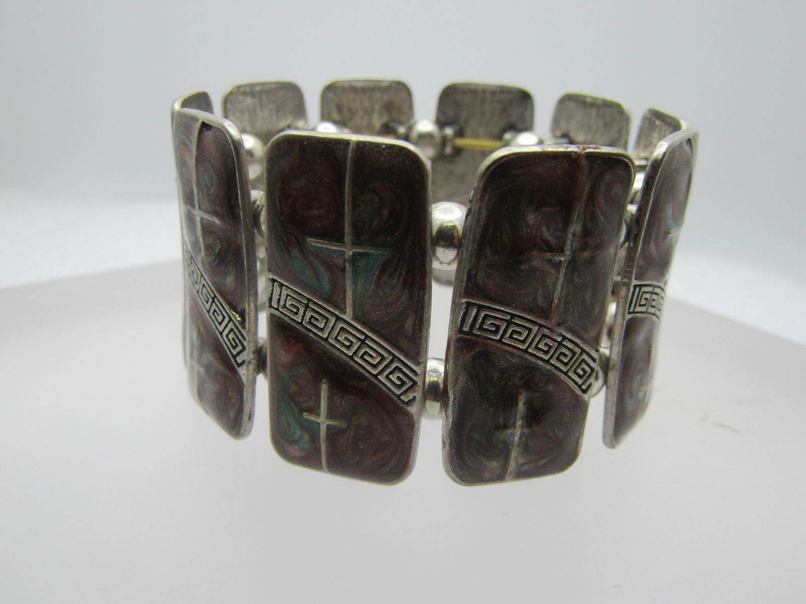 Vintage Enameled Cross Greek Key Stretch Bracelet, 1990's: Vintage Enameled Cross Greek Key Stretch Bracelet, 1990's. Enameled Cross & Green Key Bracelet. 1990's. The tiles are 1.25" tall and appx. 5/8" wide. They are rounded rectangular slightly domed pendan