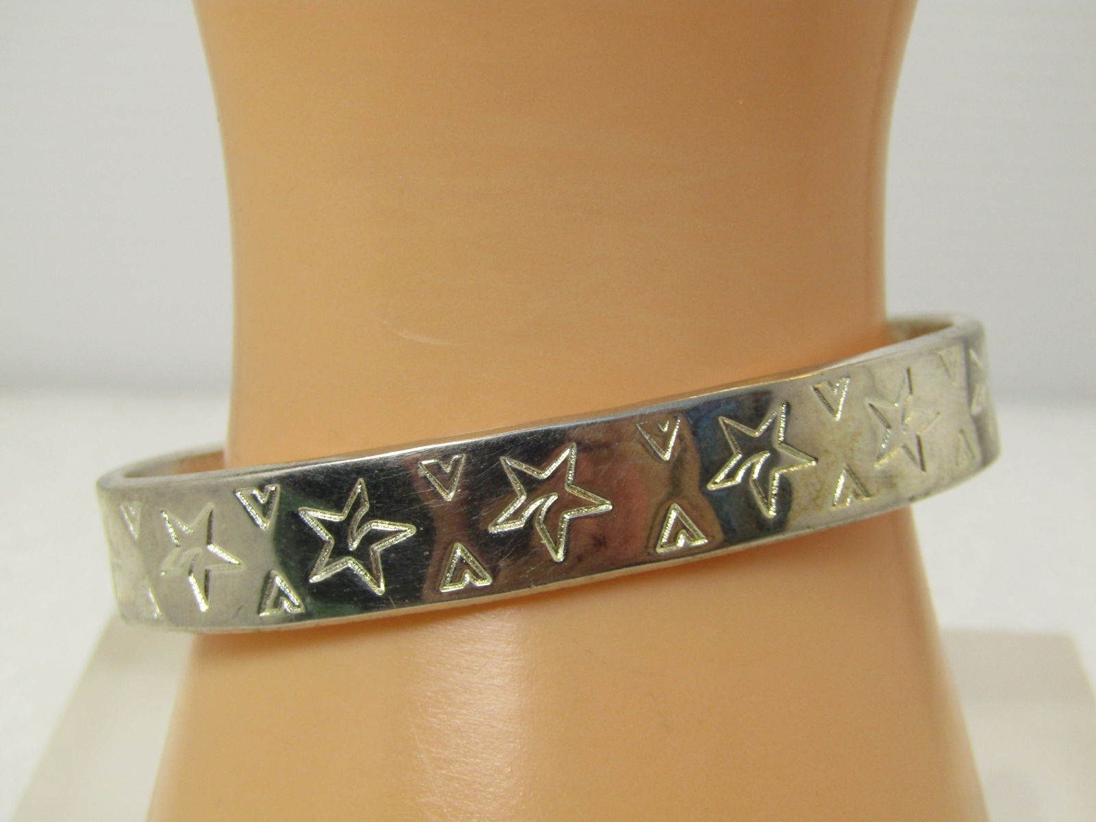 Vintage Stars Cuff Bracelet 7", 1980's, Silver Tone: Vintage Stars Cuff Bracelet 7", 1980's, Silver Tone. Celestial Themed. This is appx. 10.5mm wide. It is marked sterling but is not sterling. Bright and shiny silver tone with stars and v like triangle