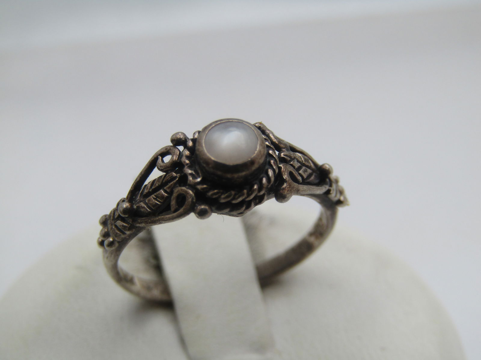 Vintage Sterling White Stone Ring, Sz. 5, Signed RSCL, 1960's-1970's: Vintage Sterling White Stone Ring, Sz. 5, Signed RSCL, 1960's-1970's. The stone looks like a white moonstone rather than mother-of-pearl. It does have a little wear on tope. It is bezel-set and appx.