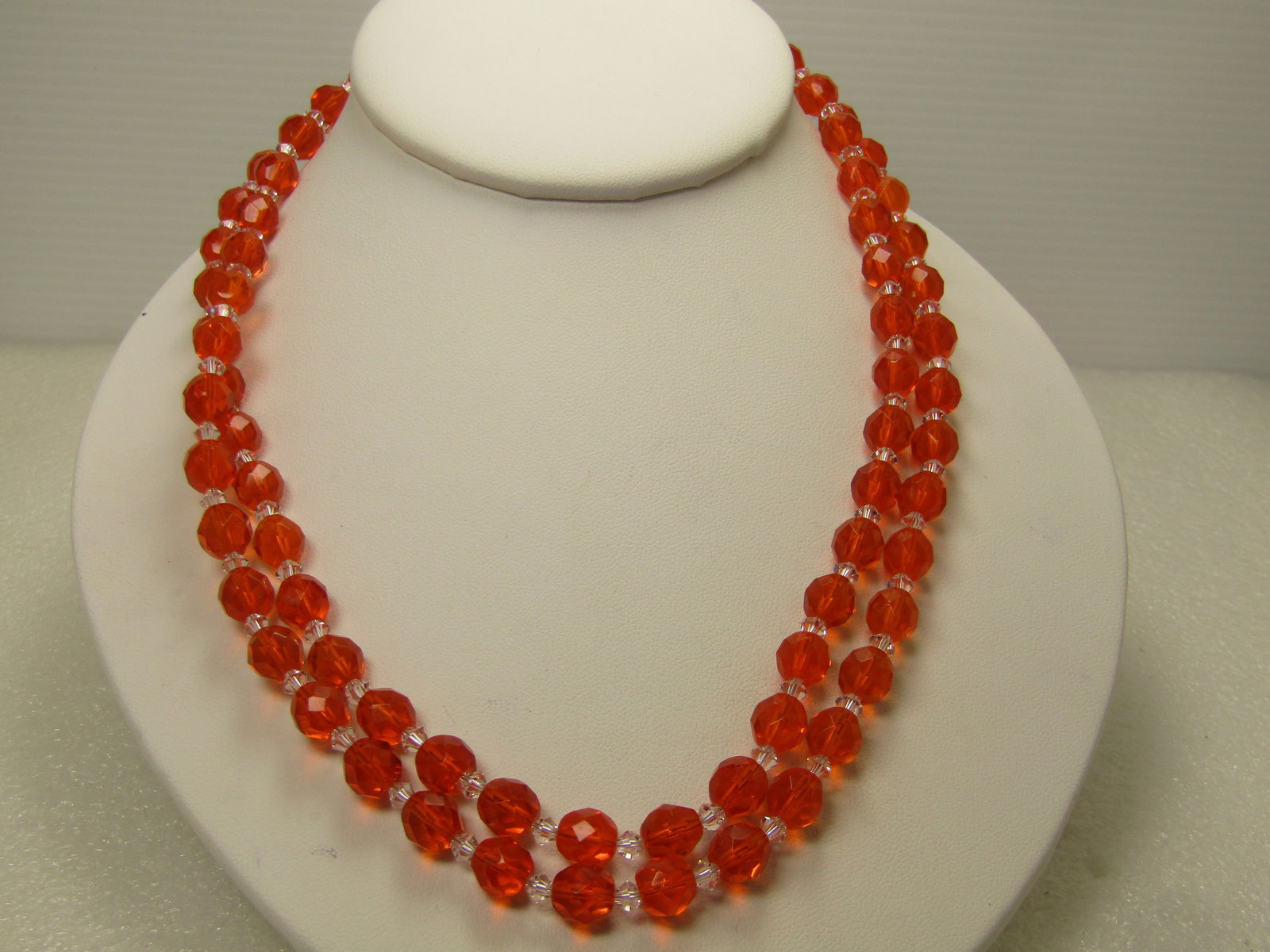 Vintage Orange & Clear Crystal Beaded Necklace, 36" 1980's: Vintage Orange & Clear Crystal Beaded Necklace, 36" 1980's. Orange appx. 7.5mm round faceted beads with clear diamodn shaped 2.5mm beads between. Silver tone beads at the clasp and with a silver tone