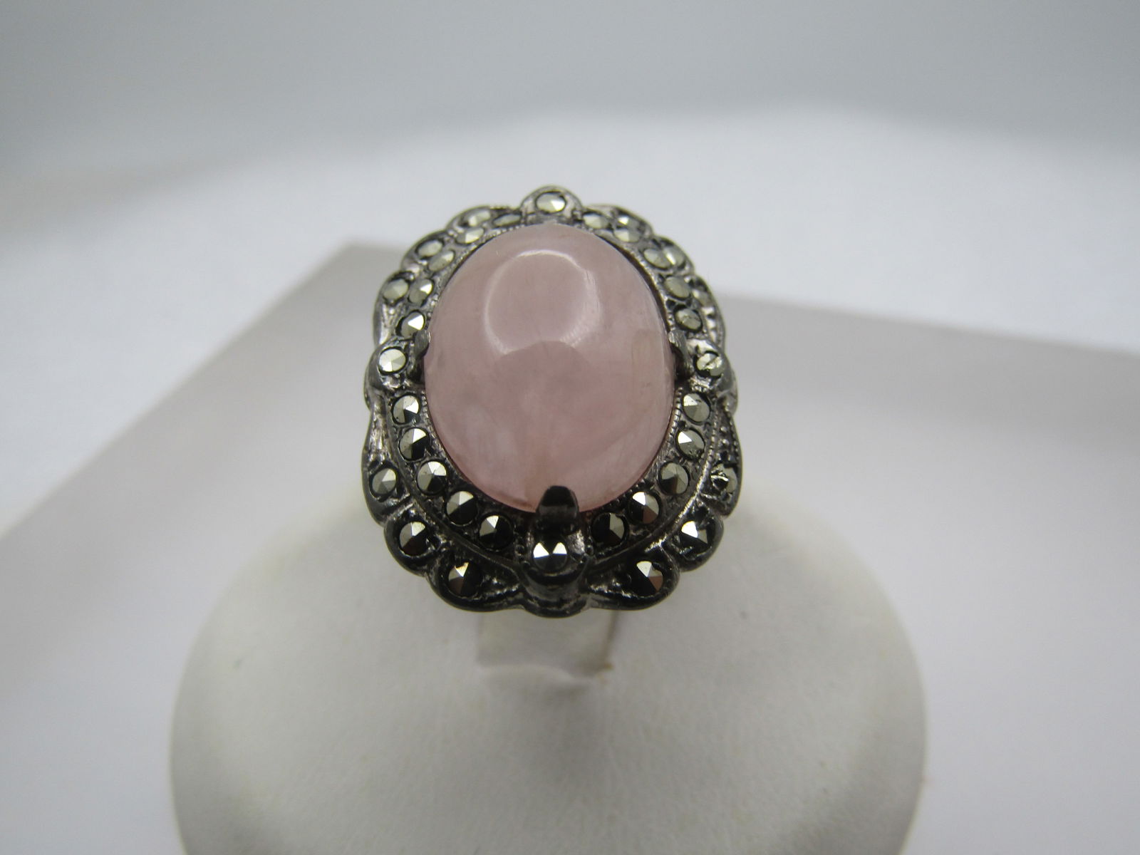Vintage Pink Quartz Marcasite Ring, Sz. 2.5, 1920's-1930's: Vintage Pink Quartz Marcasite Ring, Sz. 2.5, 1920's-1930's Truly vintage ring with an oval pink quartz cabochon that is appx. 12.5mm by 10mm. The cabochon is framed by an oval halo of macasites closes