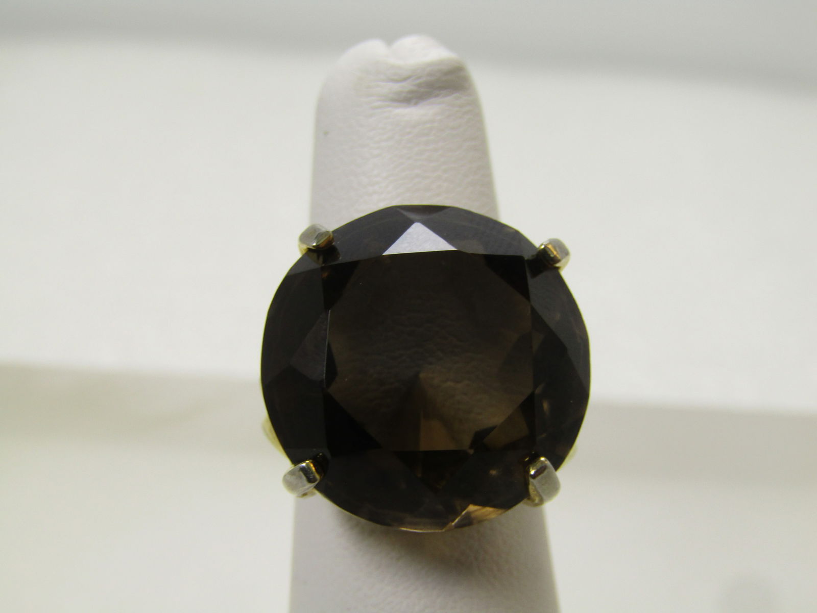 Vintage Brown Smoky Quartz Ring, Adjustable, 1980's: Vintage Brown Smoky Quartz Ring, Adjustable, 1980's. This is a gold tone ring that adjusts from sz. 6 to 9, easily. It can go slightly above and below. The stone is a round stone that is appx. 20mm an